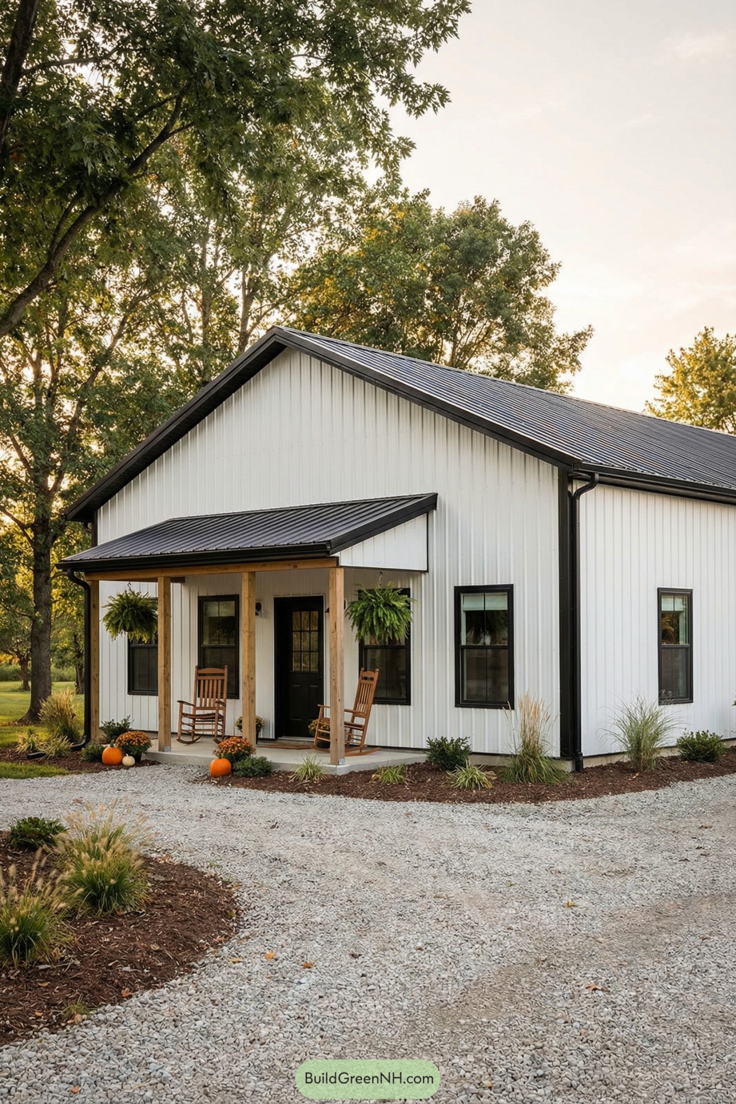 White metal-clad barn home with small porch