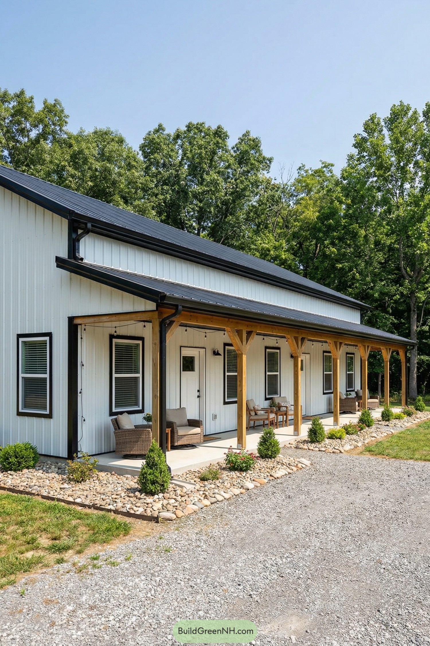 White metal-sided pole barn with long covered porch