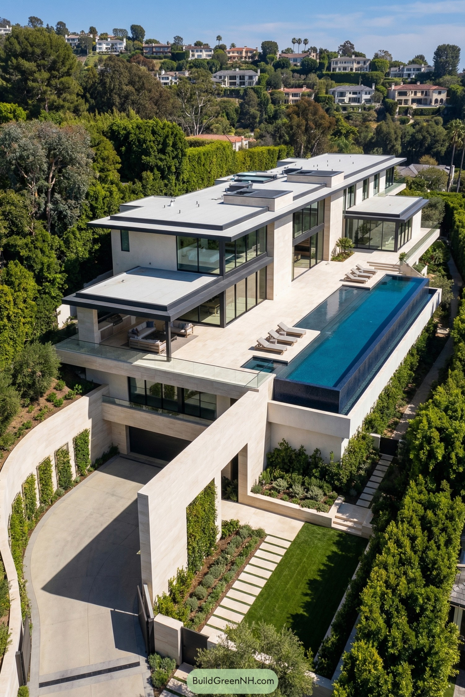 Modern hillside mansion with glass walls and infinity pool