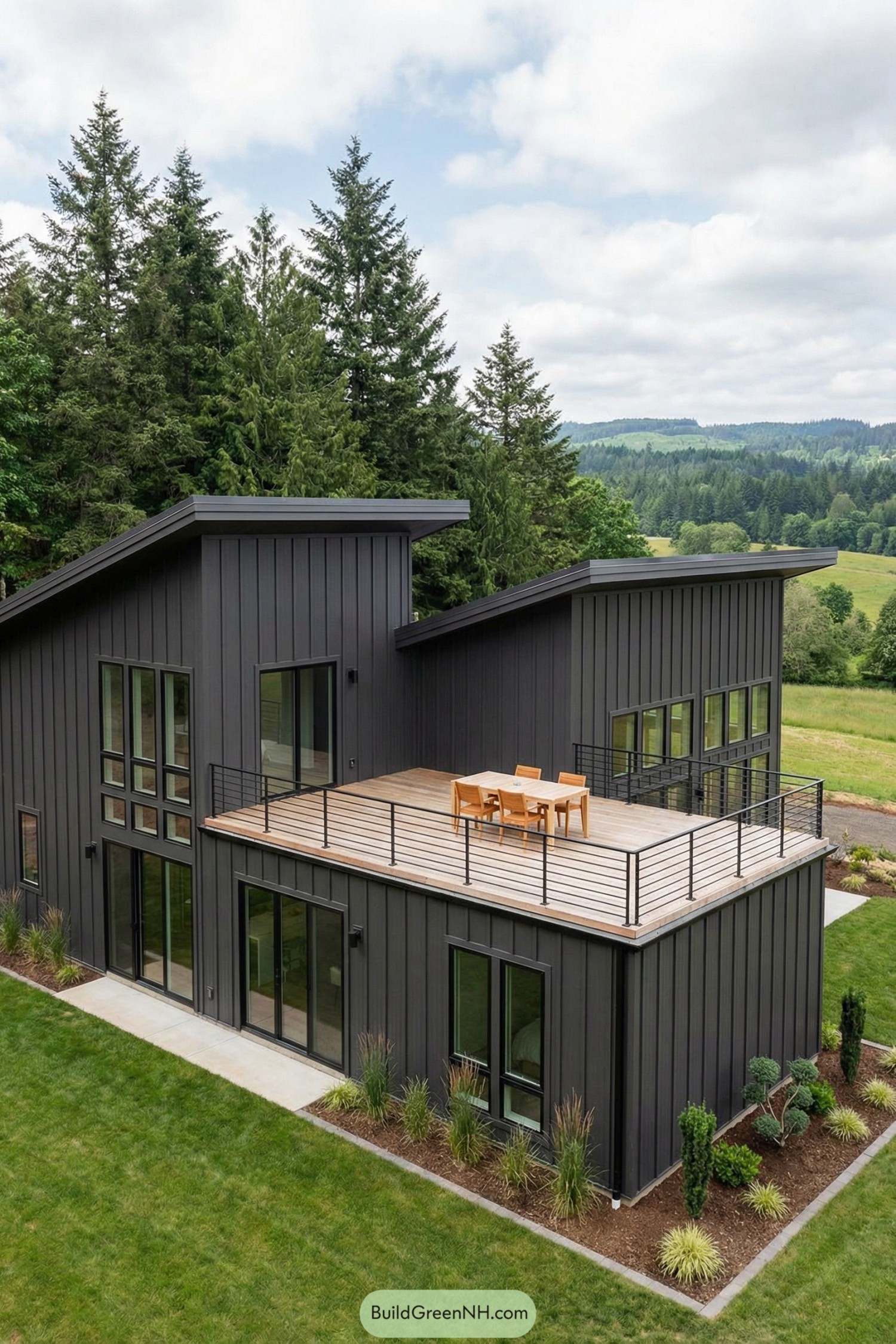 Dark modern barndominium with spacious rooftop deck overlooking green countryside