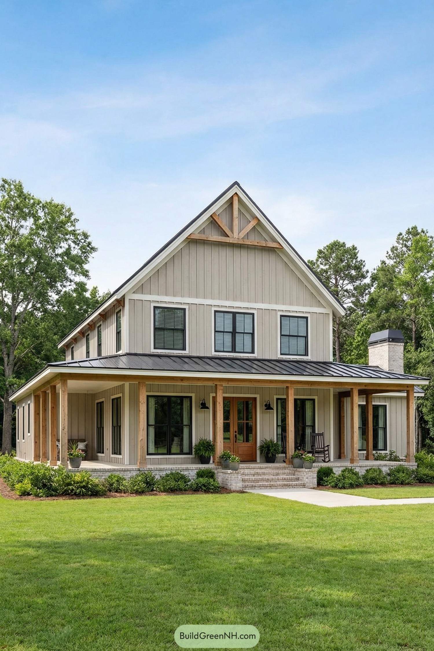 Cream vertical-panel barndominium with metal roof and wide cedar-column porch