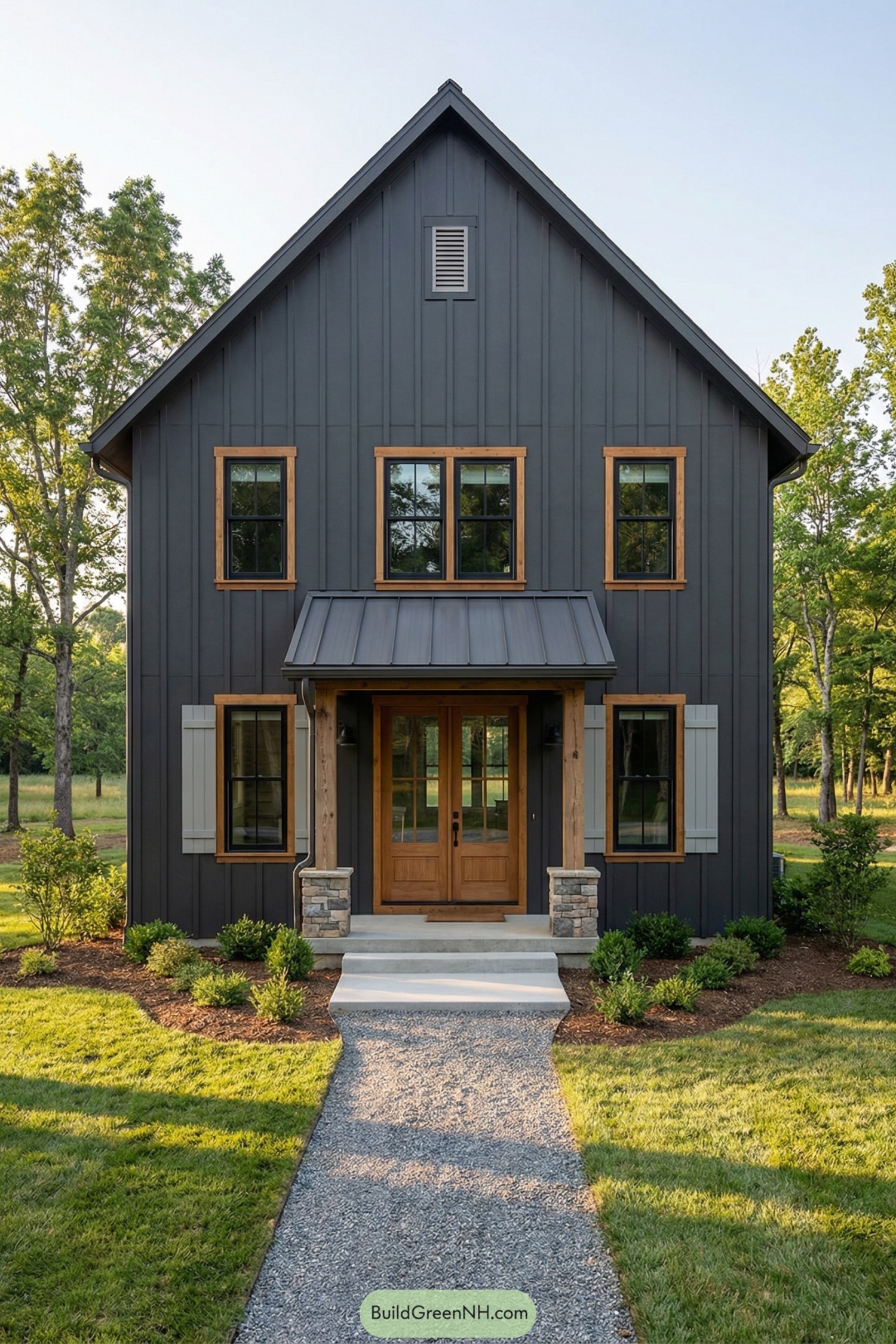 Dark board-and-batten cottage with warm wood trim and small covered front porch