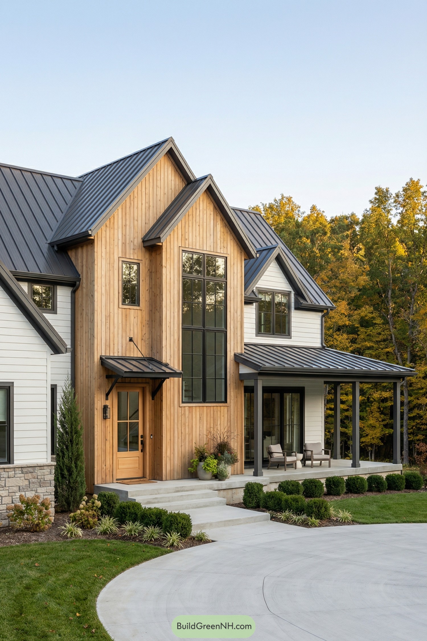 Contemporary farmhouse exterior with wood siding and dark metal roof