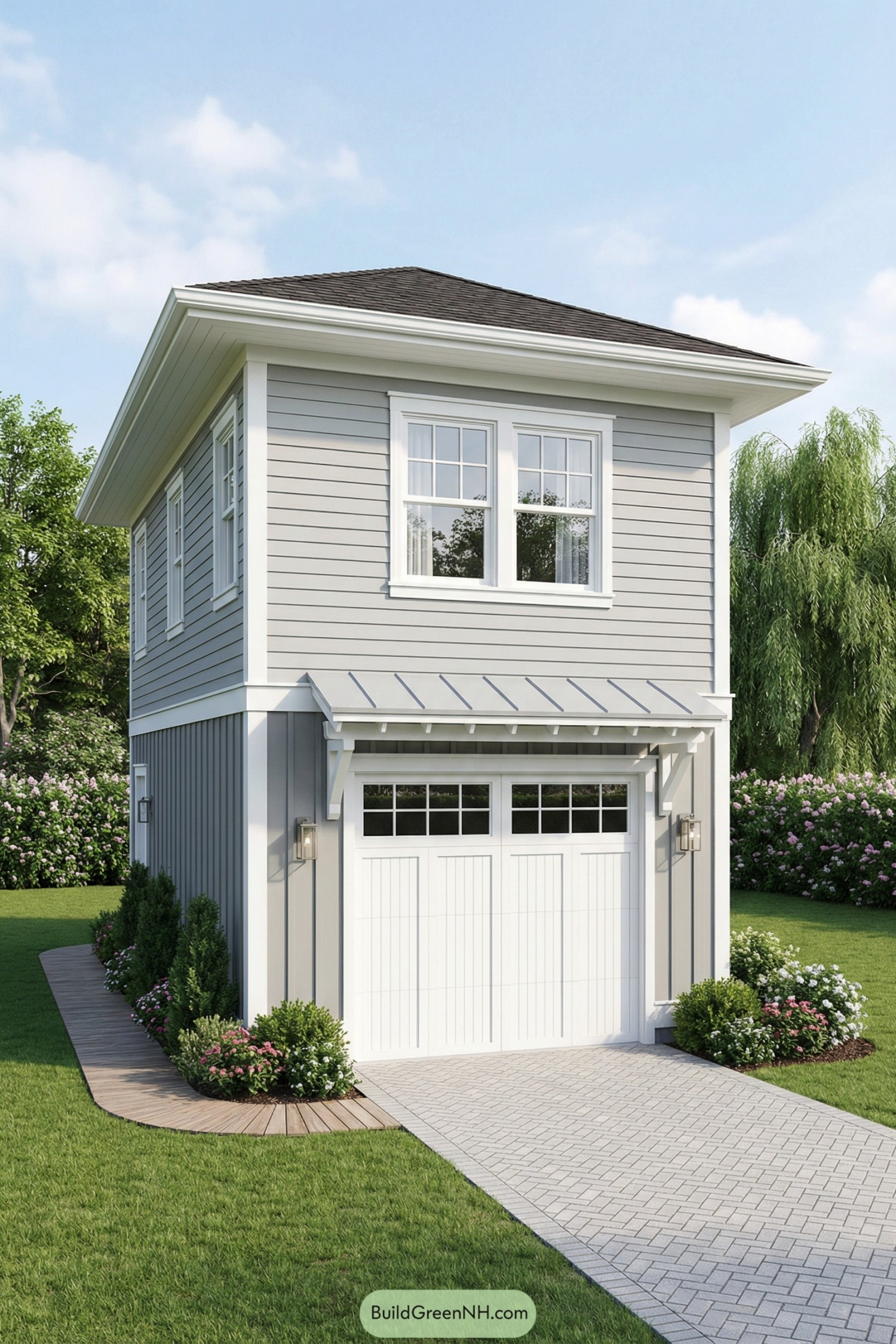 Two-story gray garage with white trim and landscaped driveway