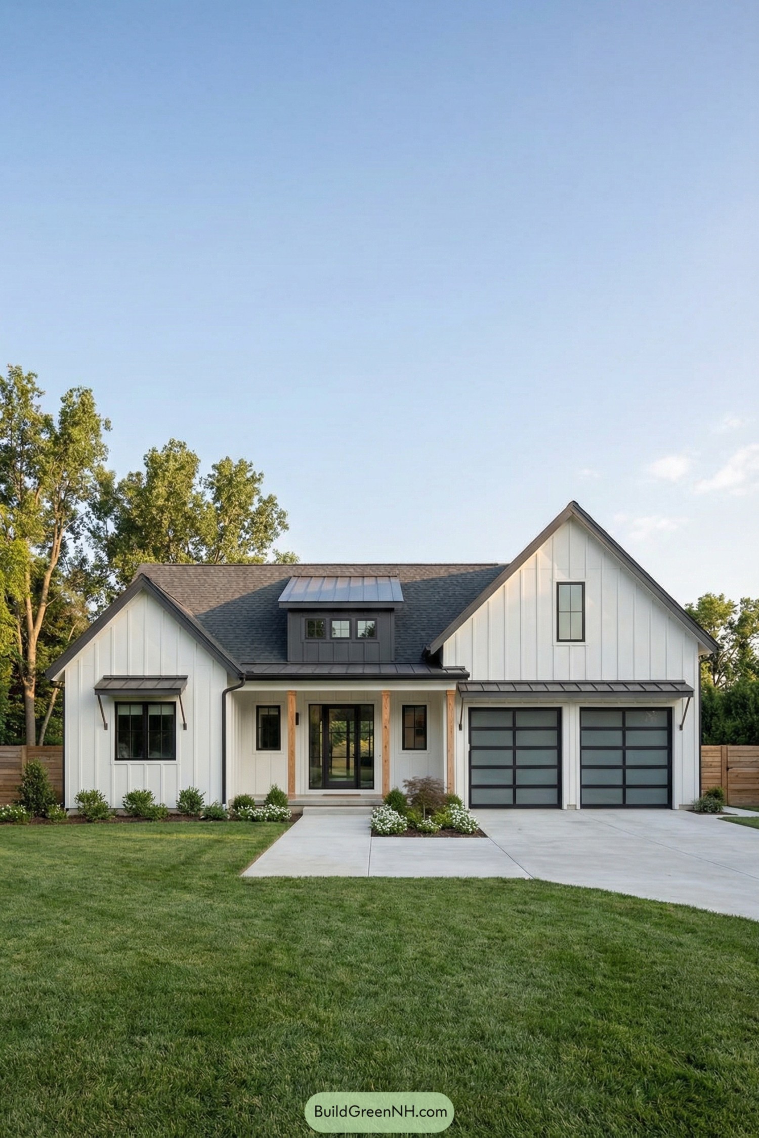White board-and-batten house with double modern garage doors and a central porch