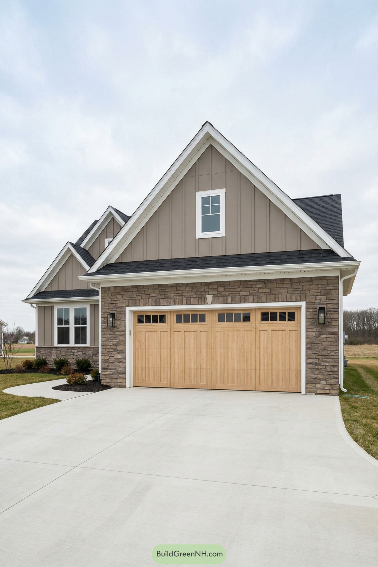 Two-car stone-front garage with light wood doors and gabled roof