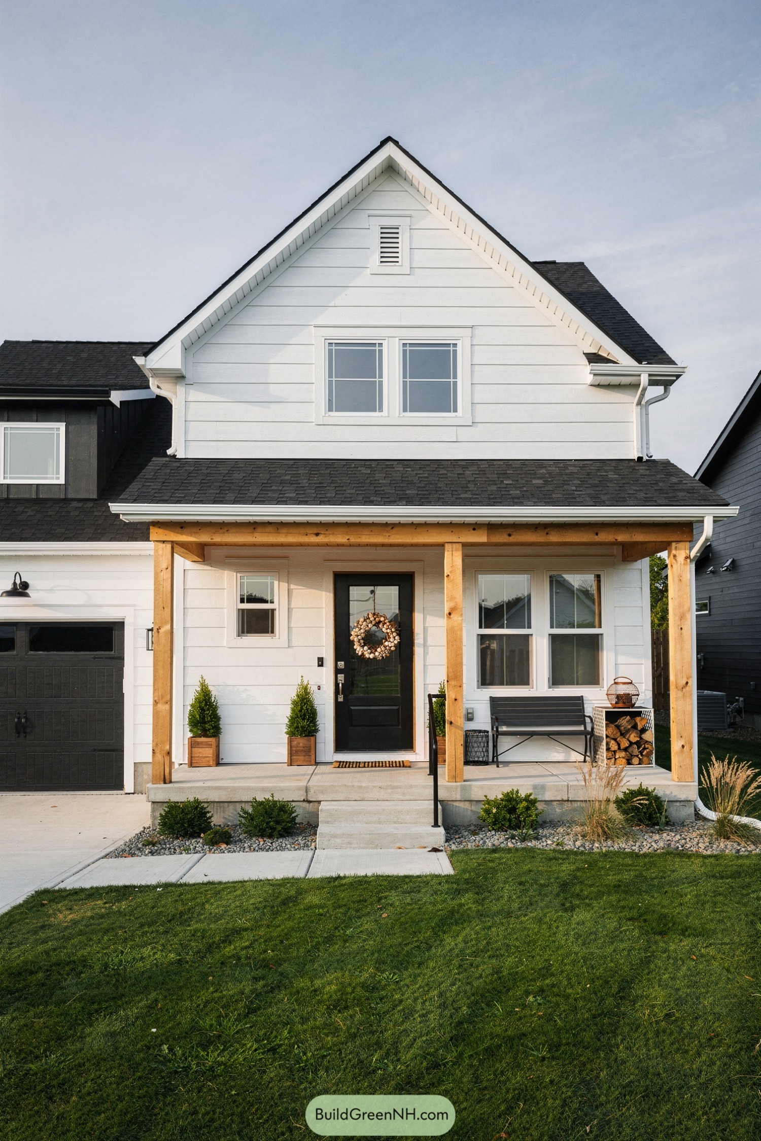White shiplap farmhouse exterior with wood posts