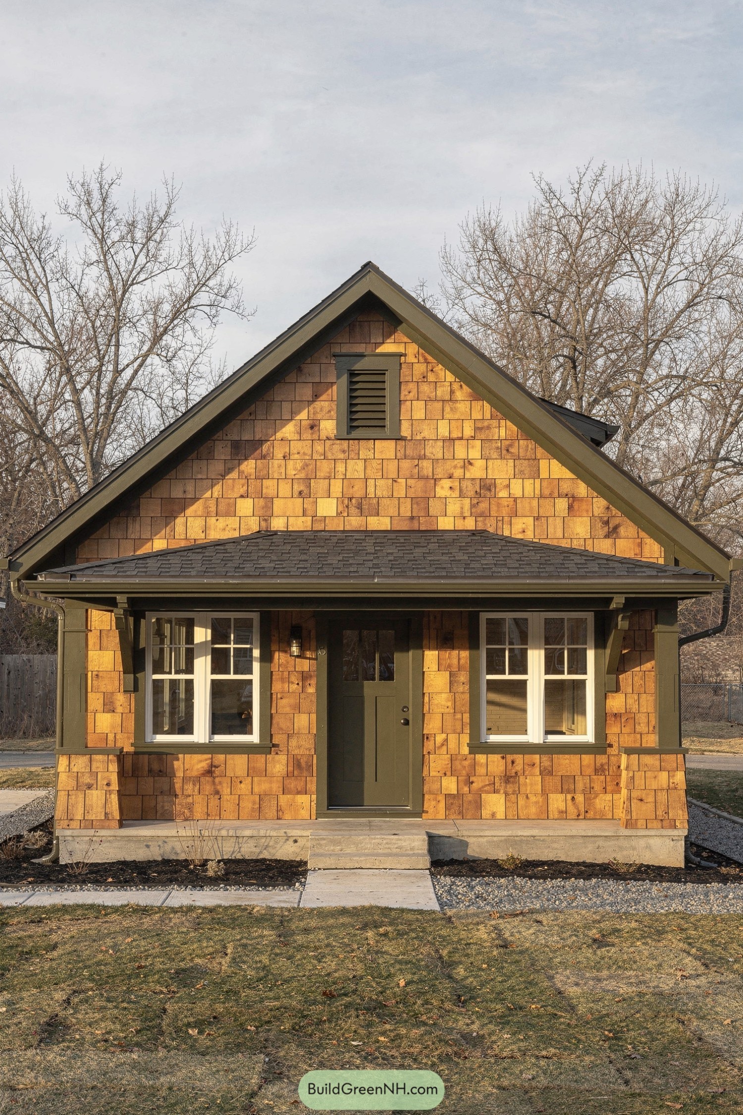 Small cedar shingle house with green trim