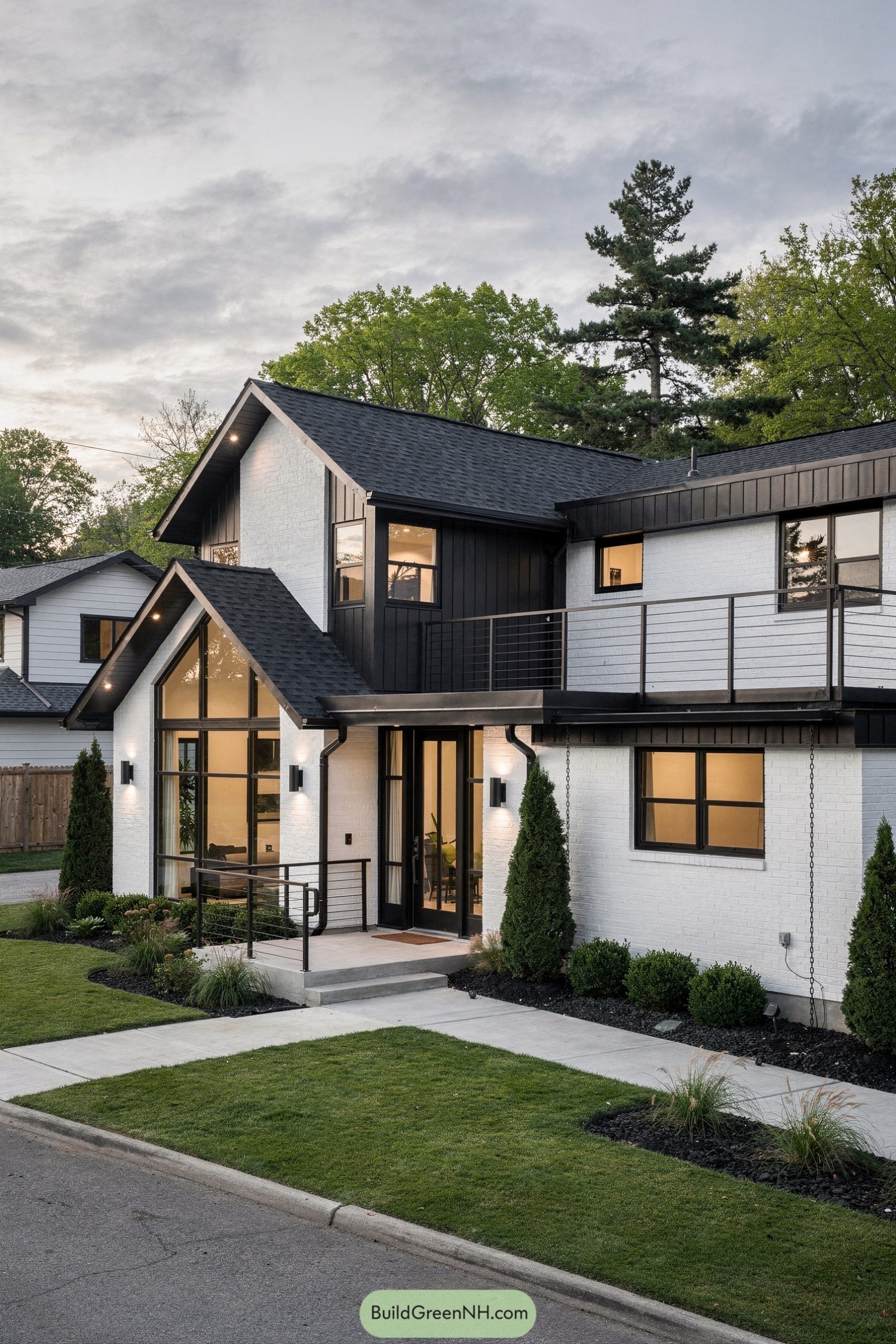 Modern black and white gabled house with large windows