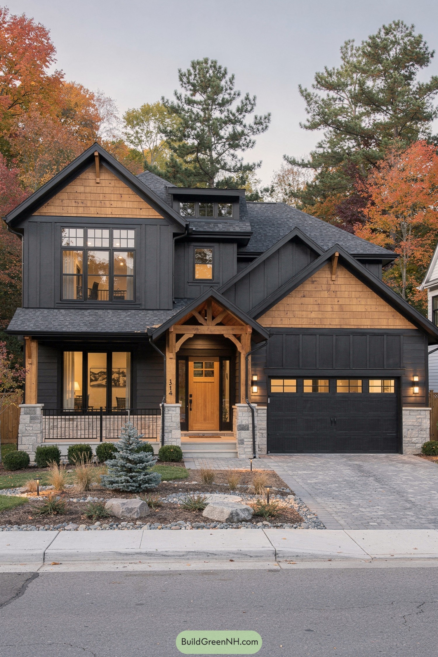Two-story modern house with dark charcoal siding, warm natural wood accents, and a front porch framed by timber posts