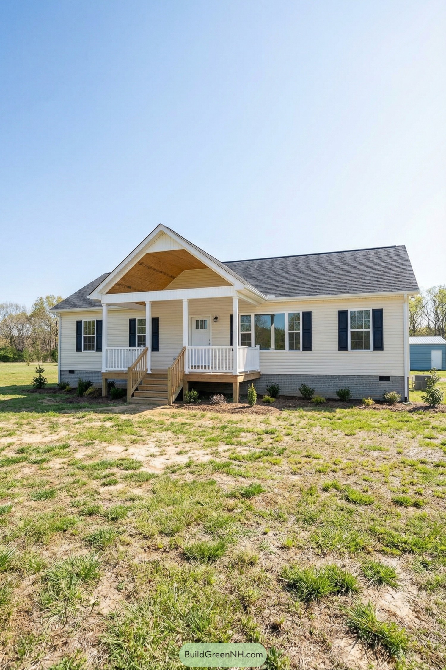 Single-story white house with raised gabled front porch