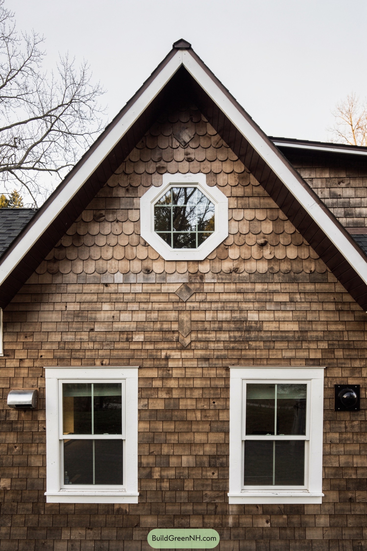 Cedar shingle house front with octagon window