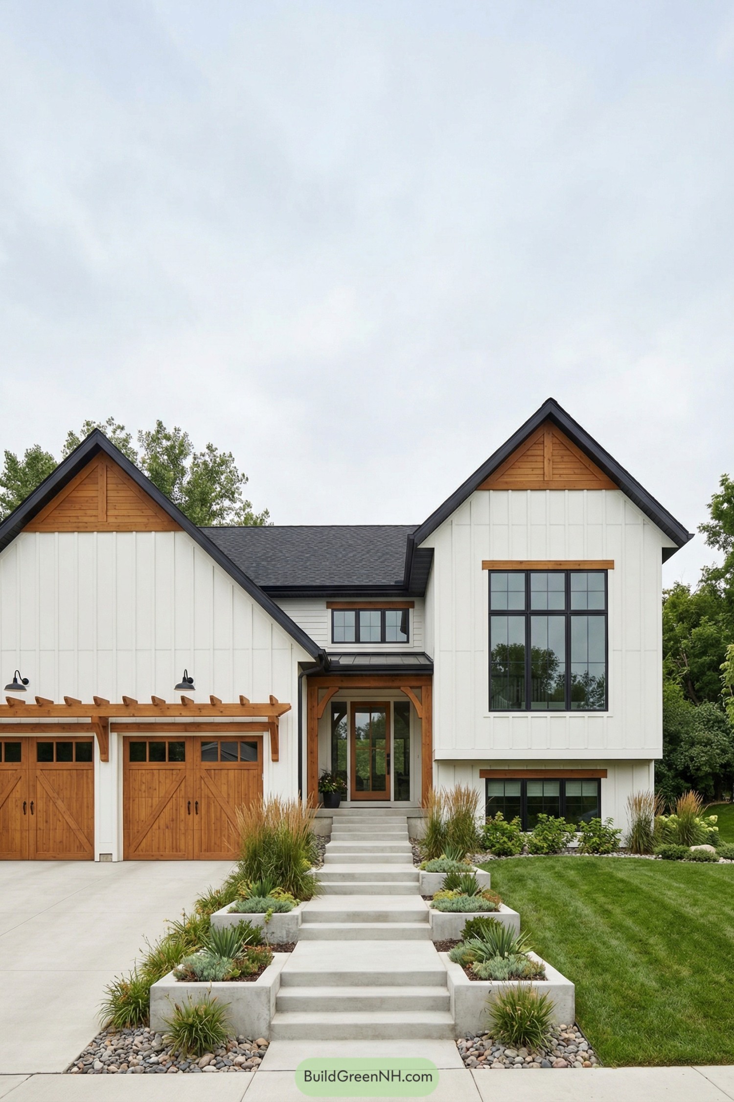 Modern farmhouse with white vertical siding, black roof, large front windows, and warm wood accents around the entry and garage