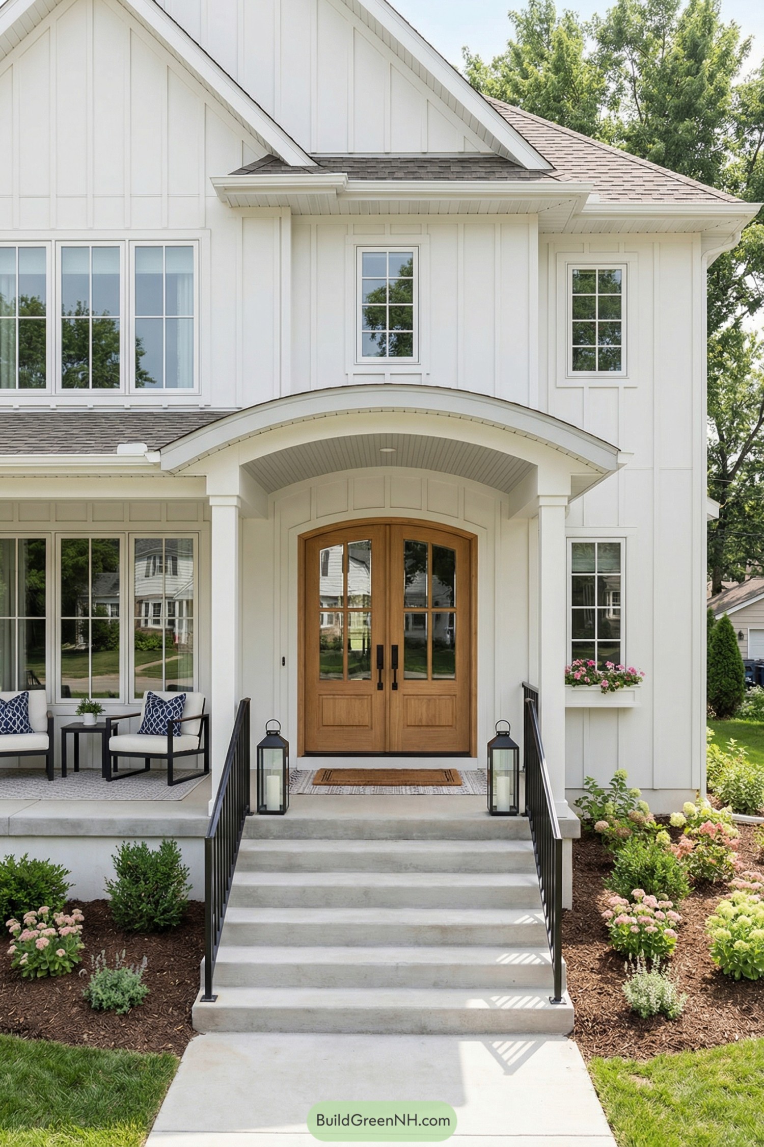 White farmhouse exterior with arched double wood door