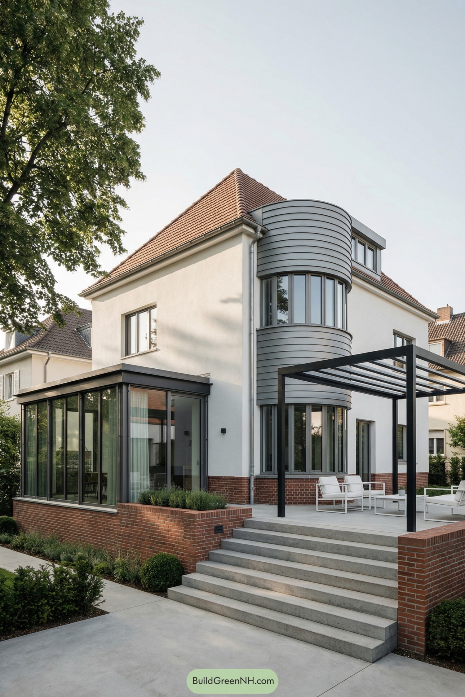 Modern art deco house with curved glass bay and open patio