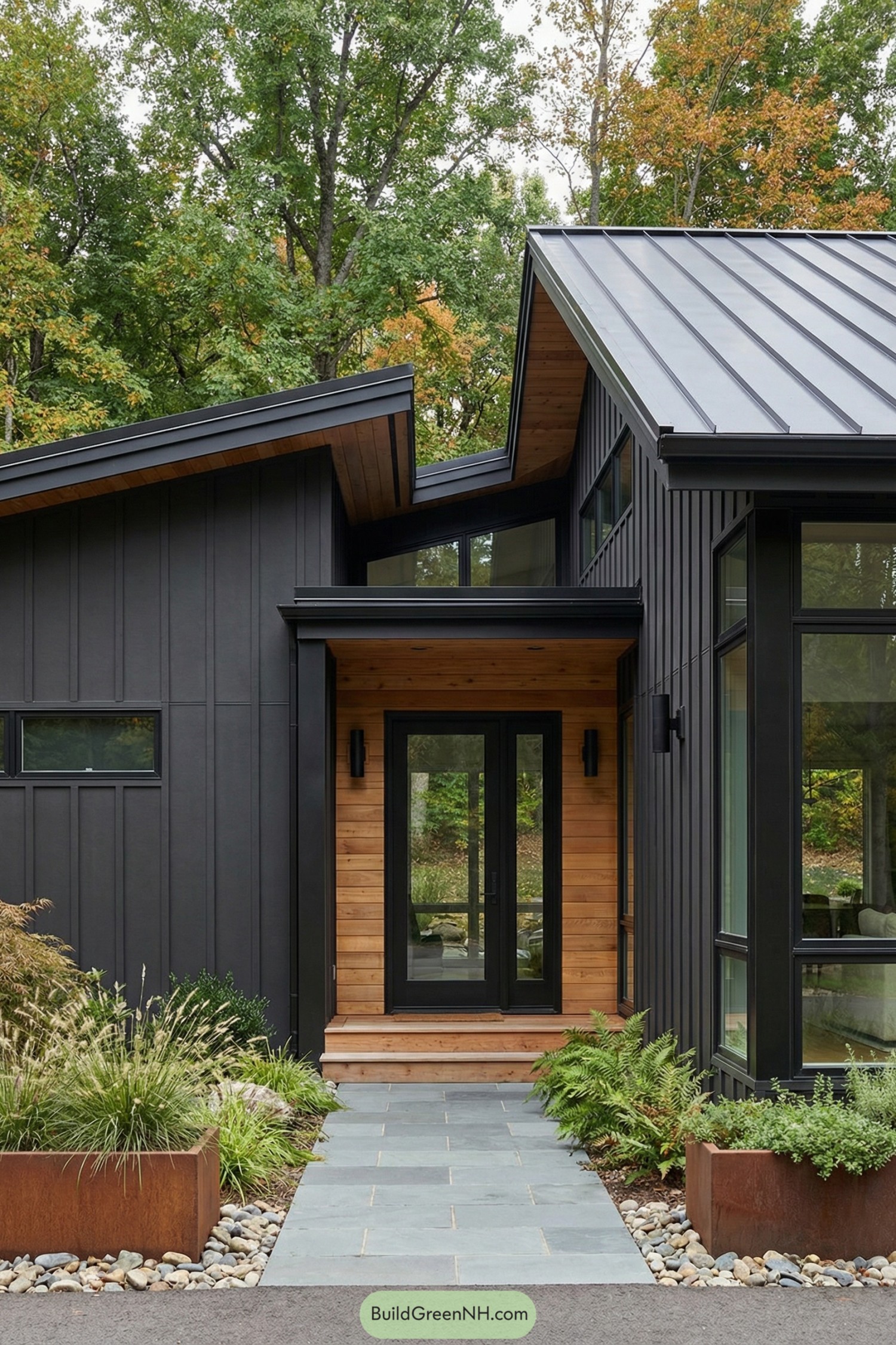 Dark modern house with cedar entry and metal roof