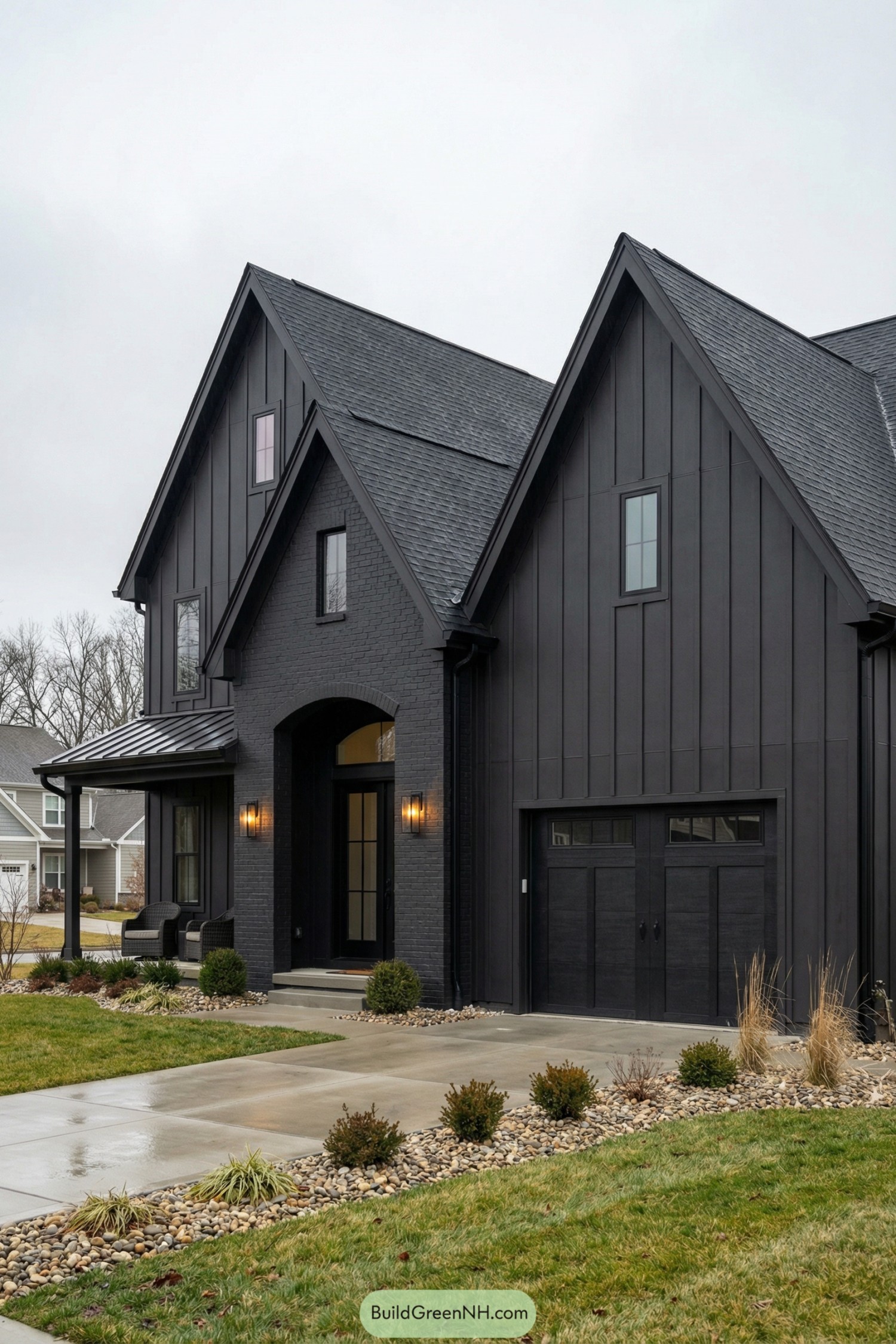 Dark modern farmhouse with tall black gables and a clean landscaped front yard