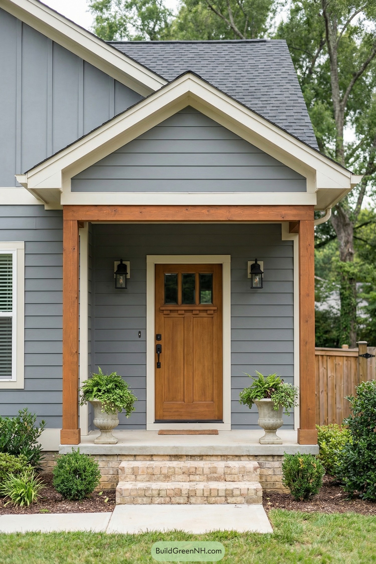 Grey house entry with wood-trimmed porch