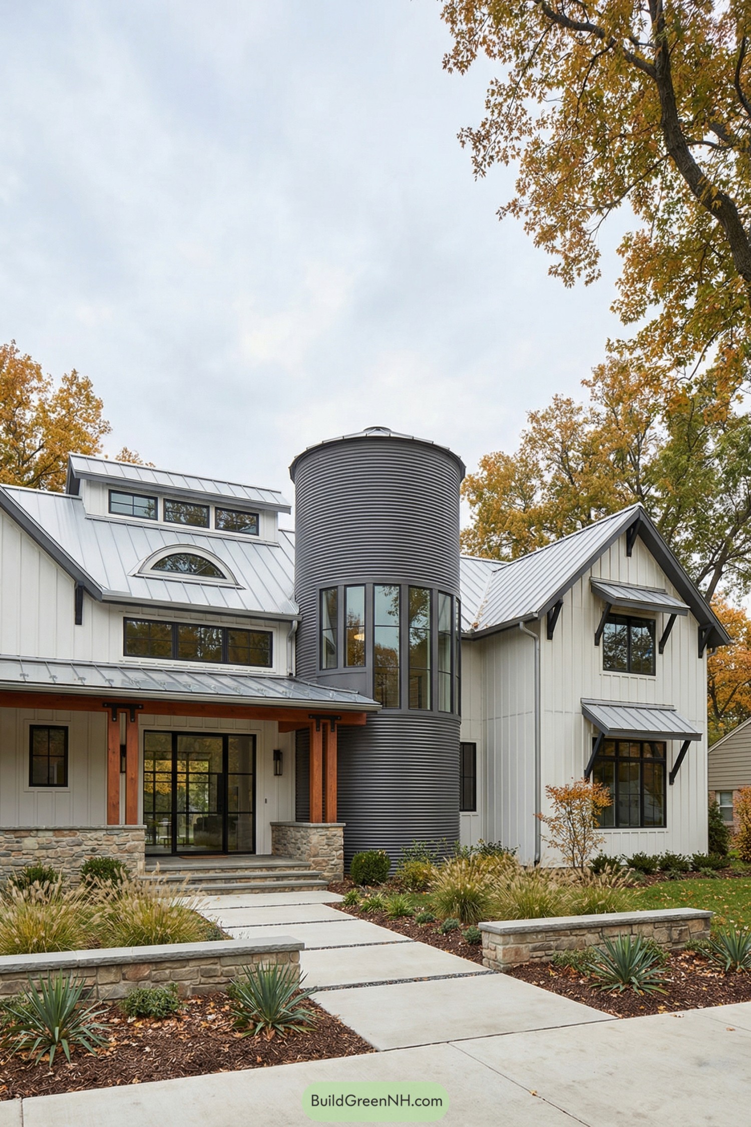 Modern farmhouse with central gray silo tower