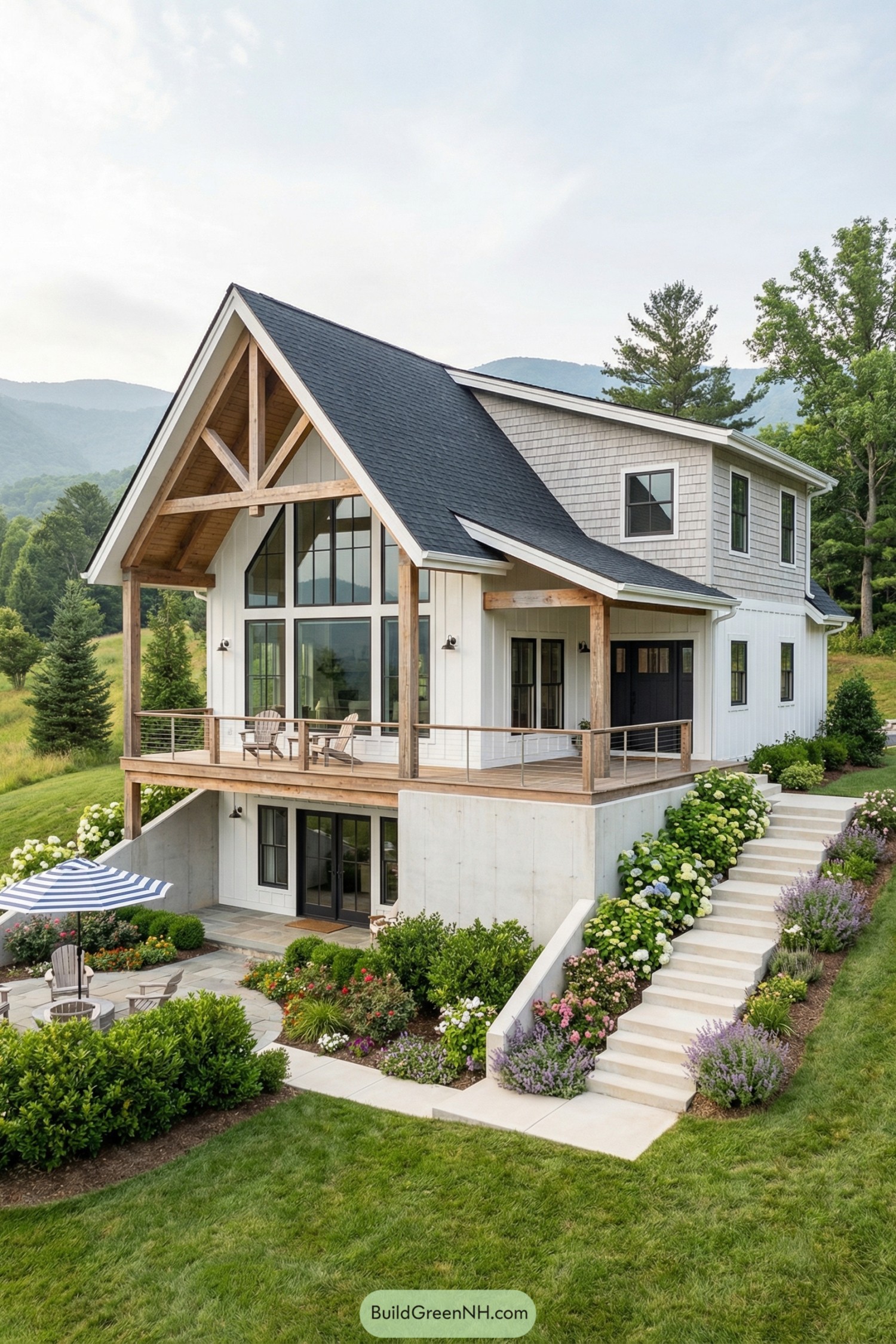Modern mountain house with large windows and tiered patios surrounded by lush landscaping
