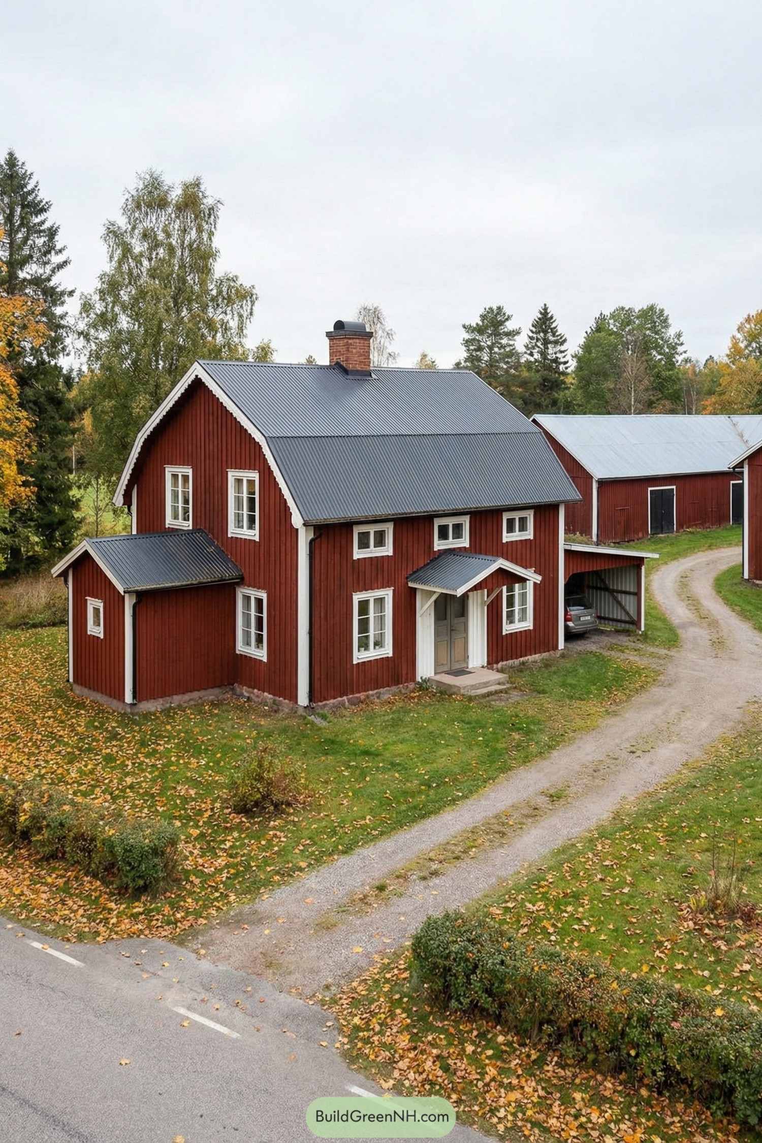 Red wooden Swedish farmhouse with gray metal roof and small carport along a gravel drive