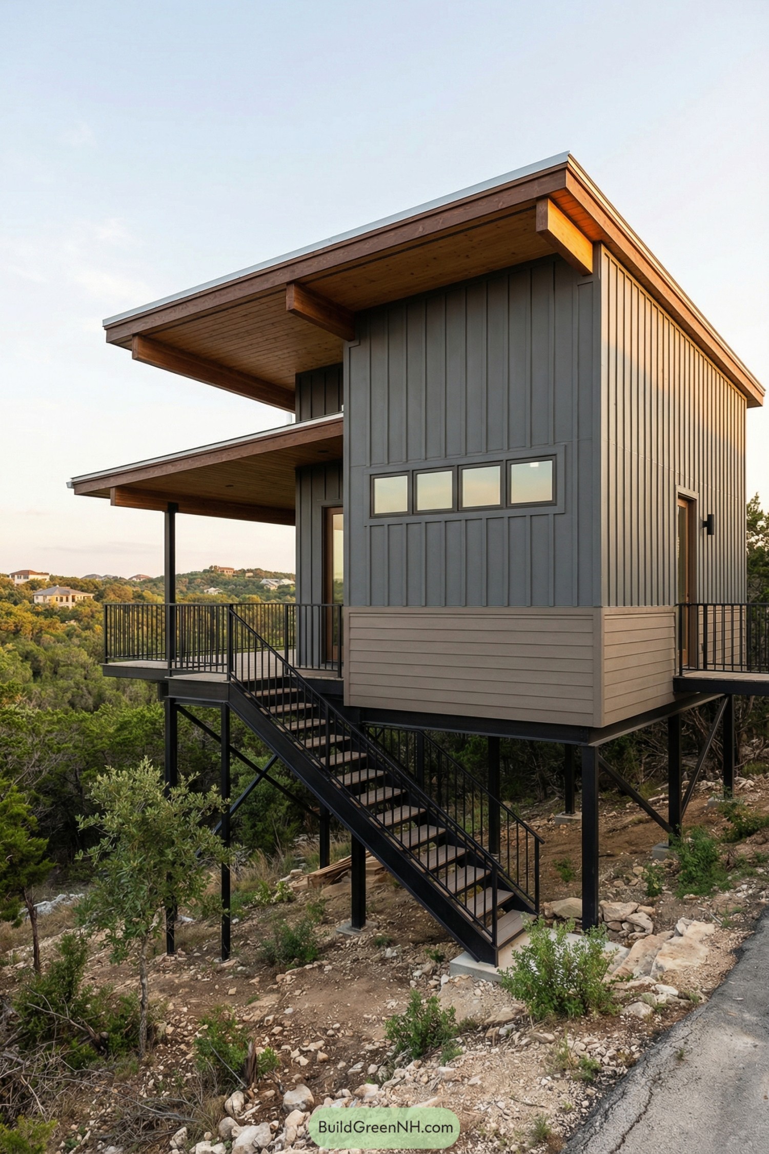 Modern gray stilt cabin overlooking forest