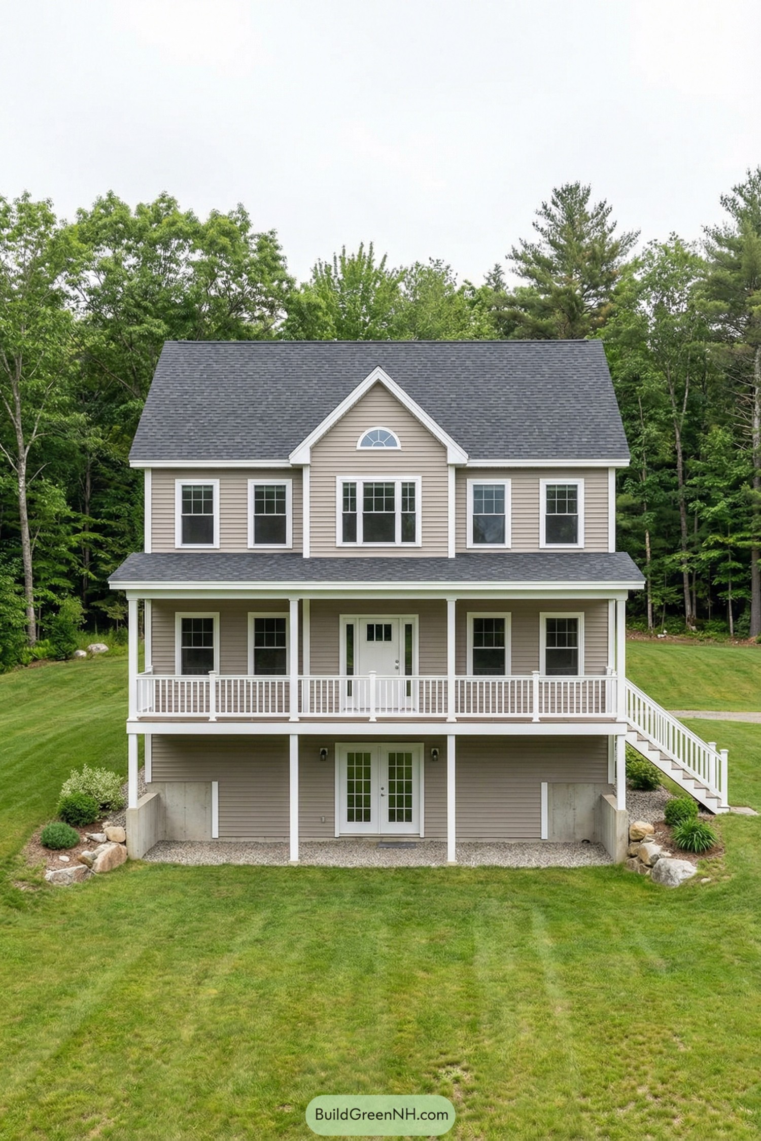 Two story tan cottage with full front porch and walkout lower level