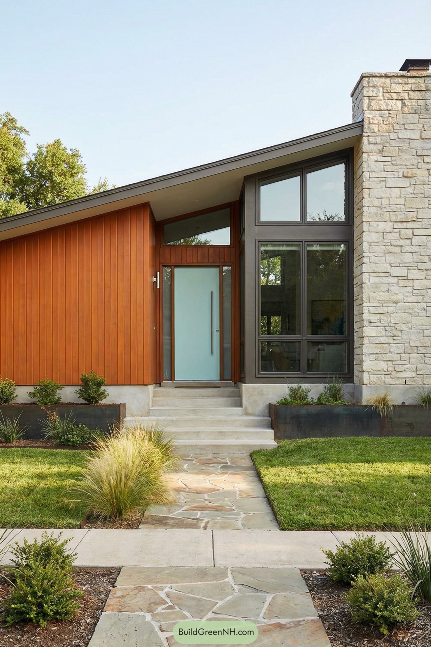 architecture design of 70s house exterior, low single-story mid-century modern facade with strong asymmetrical composition, wide horizontal front, left side clad in vertical wood panels, right side dominated by tall stone chimney wall and large picture windows, warm earthy and natural color palette with burnt-orange wood siding, pale beige-gray stone, white roof trim, dark metal window frames, and a light aqua front door as accent, elongated rectangular footprint with clean straight lines and a dramatic single shed roof sloping up from left to right, construction in mixed materials: vertical tongue-and-groove wood siding, rough-cut ashlar stone veneer, concrete or masonry base, raised planter boxes in corten or dark-painted metal, and a flagstone entry path set in grass, roof style as single-plane shed roof with deep overhangs, thin white fascia boards, and a flat dark roofing surface, window style as large floor-to-ceiling fixed panes with narrow aluminum or steel frames, divided into rectangular modules with upper clerestory and triangular sections following the roof angle, door style as flush modern slab door in smooth finish, light aqua color, full-height vertical metal pull handle, framed by narrow transom window above, front steps in wide shallow stone or concrete slabs leading from irregular-cut stone walkway through minimalist modern landscaping of trimmed lawn, ornamental grasses, and low shrubs.