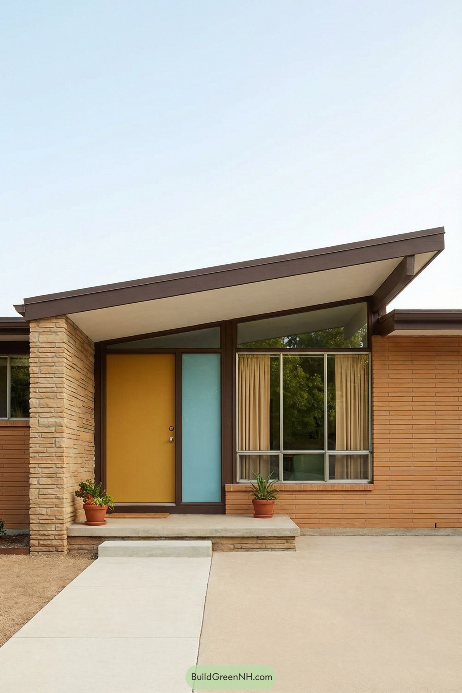 Midcentury entry with sloped roof and yellow door
