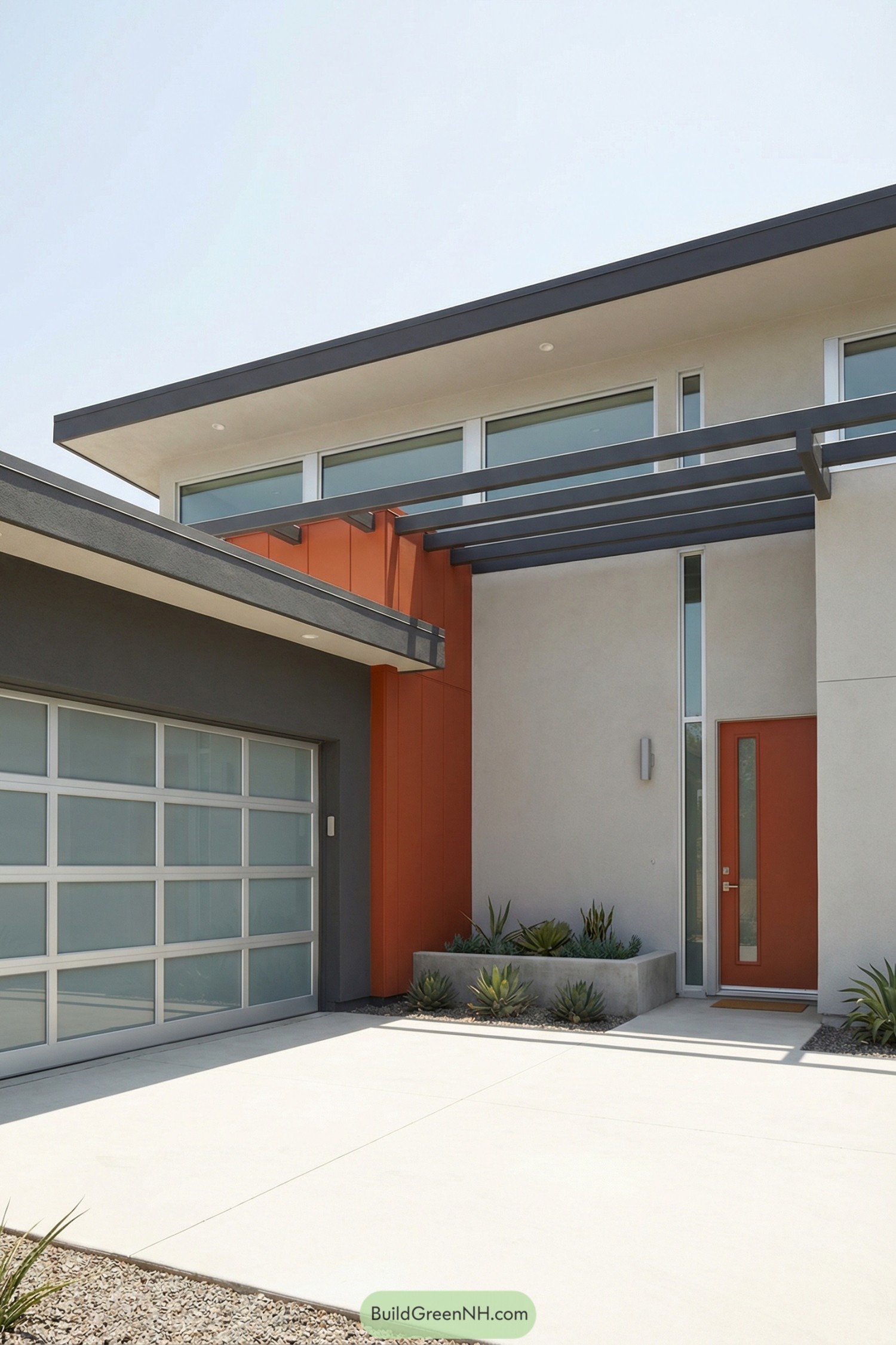 Modern stucco house front with orange entry wall, glass garage door, and sleek overhead trellis