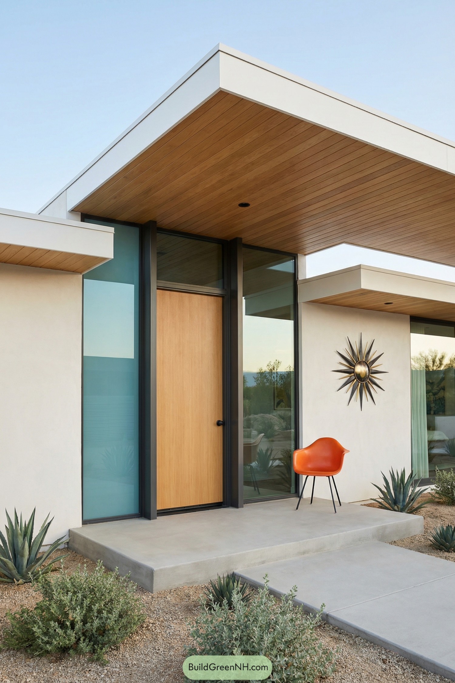 Midcentury front entry with wide overhang and orange chair