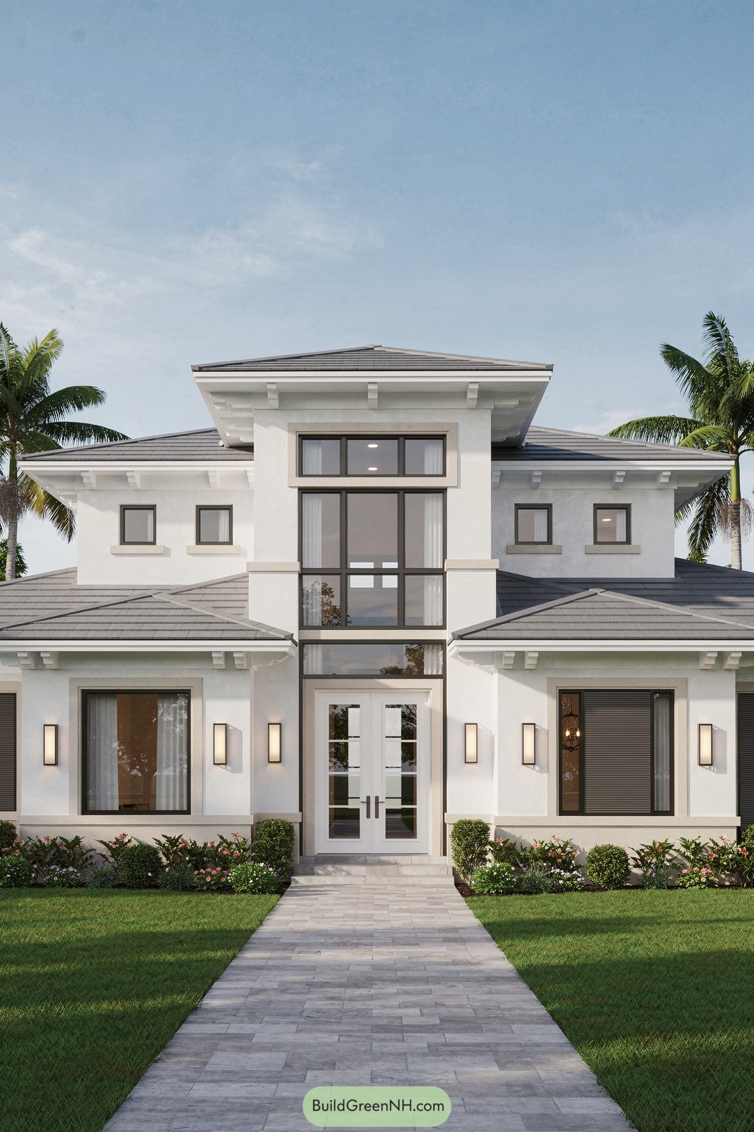 Modern white two-story Florida home with central glass tower entry and landscaped front walk