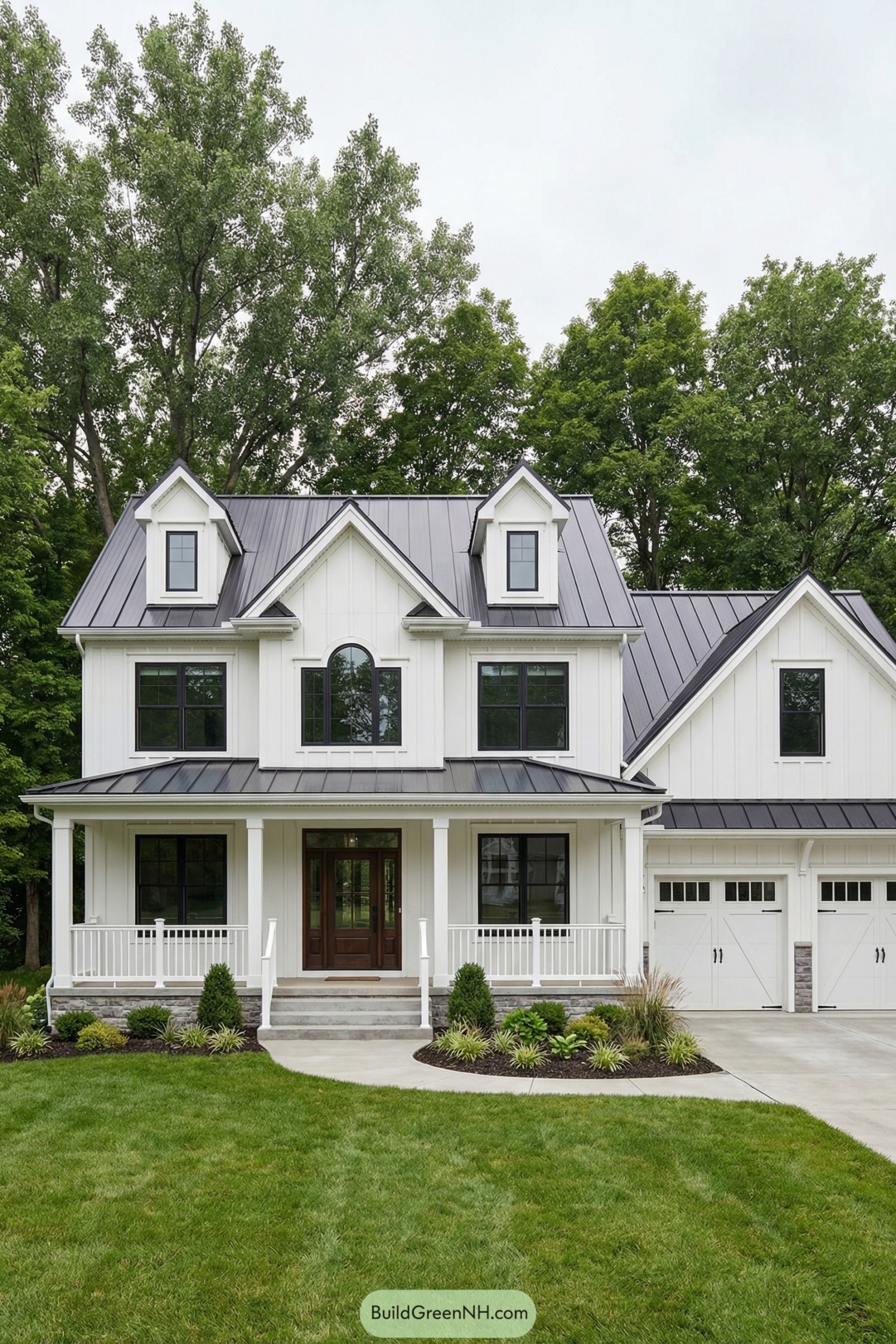 White two story modern farmhouse with metal roof
