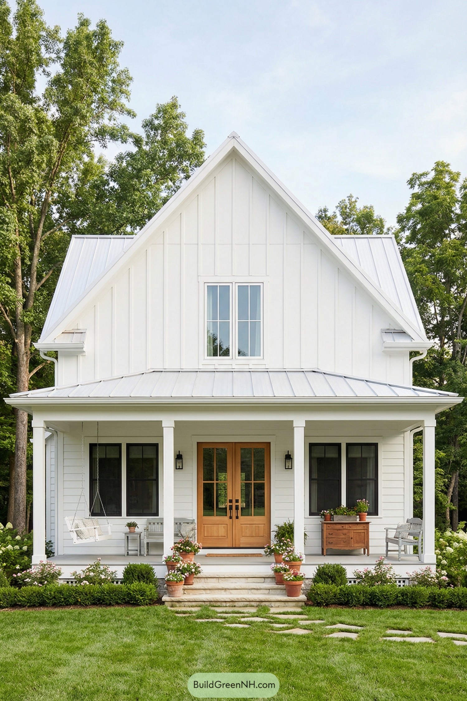White farmhouse cottage with front porch and garden
