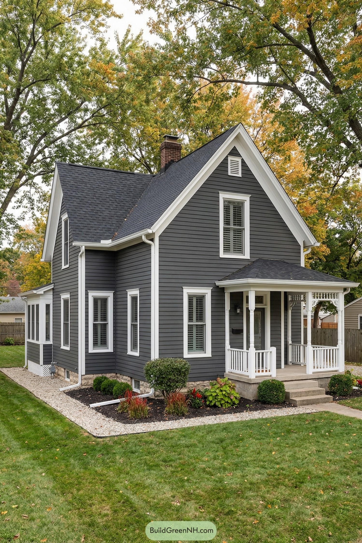 Gray cottage with white trim and porch