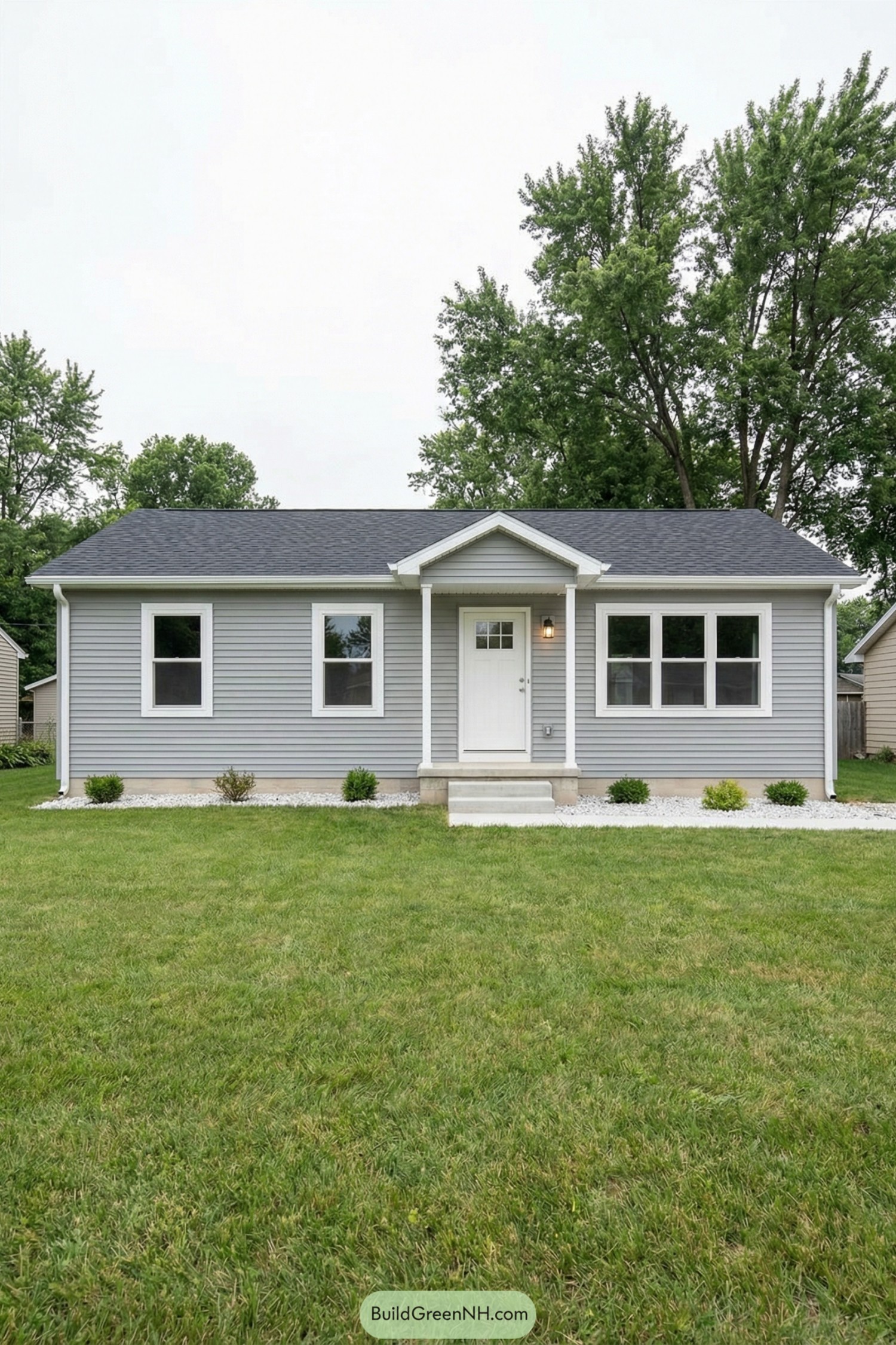 Gray single story house with white trim and front entry stoop