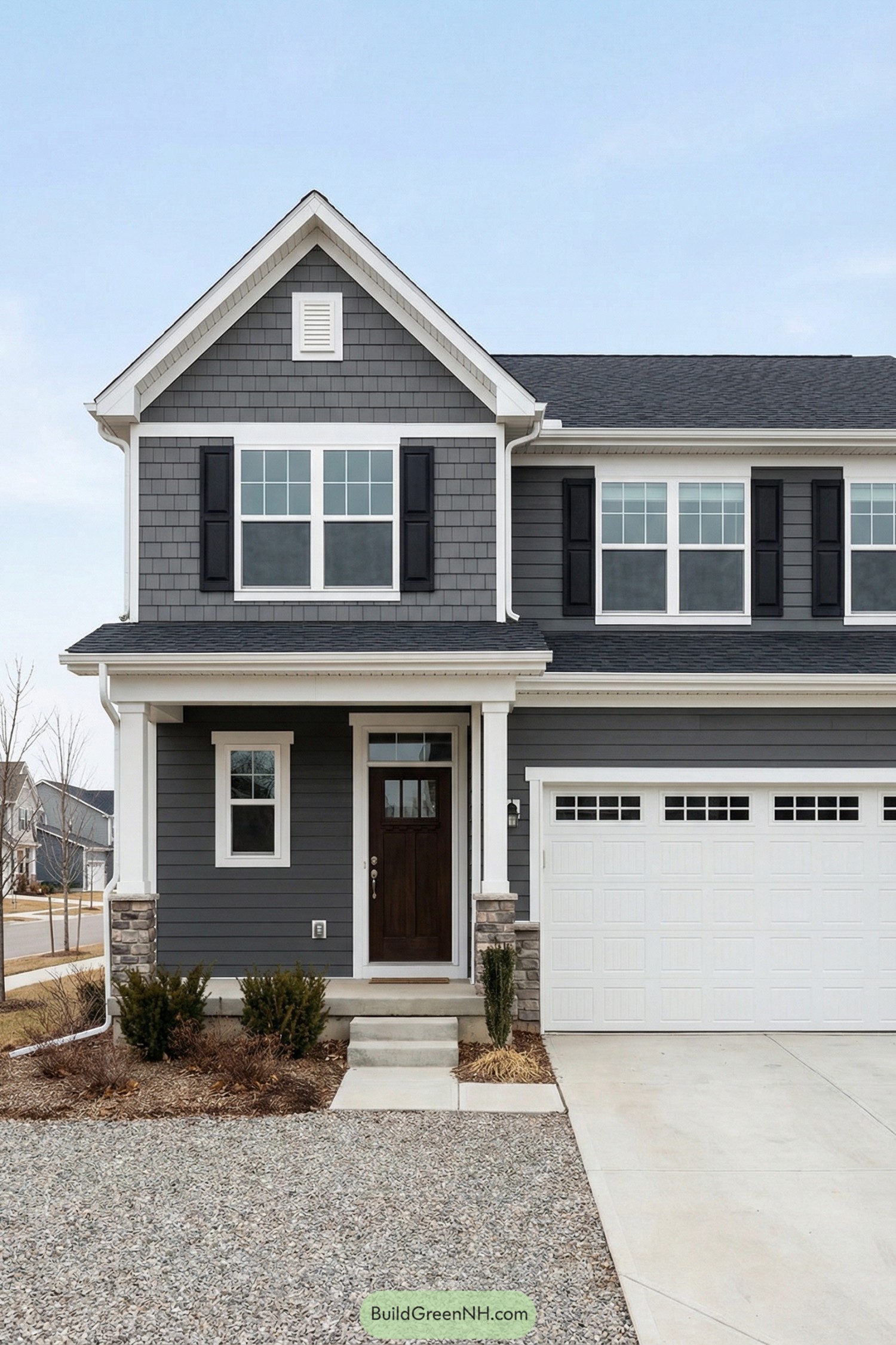 Two story gray house with white trim black shutters and attached white garage