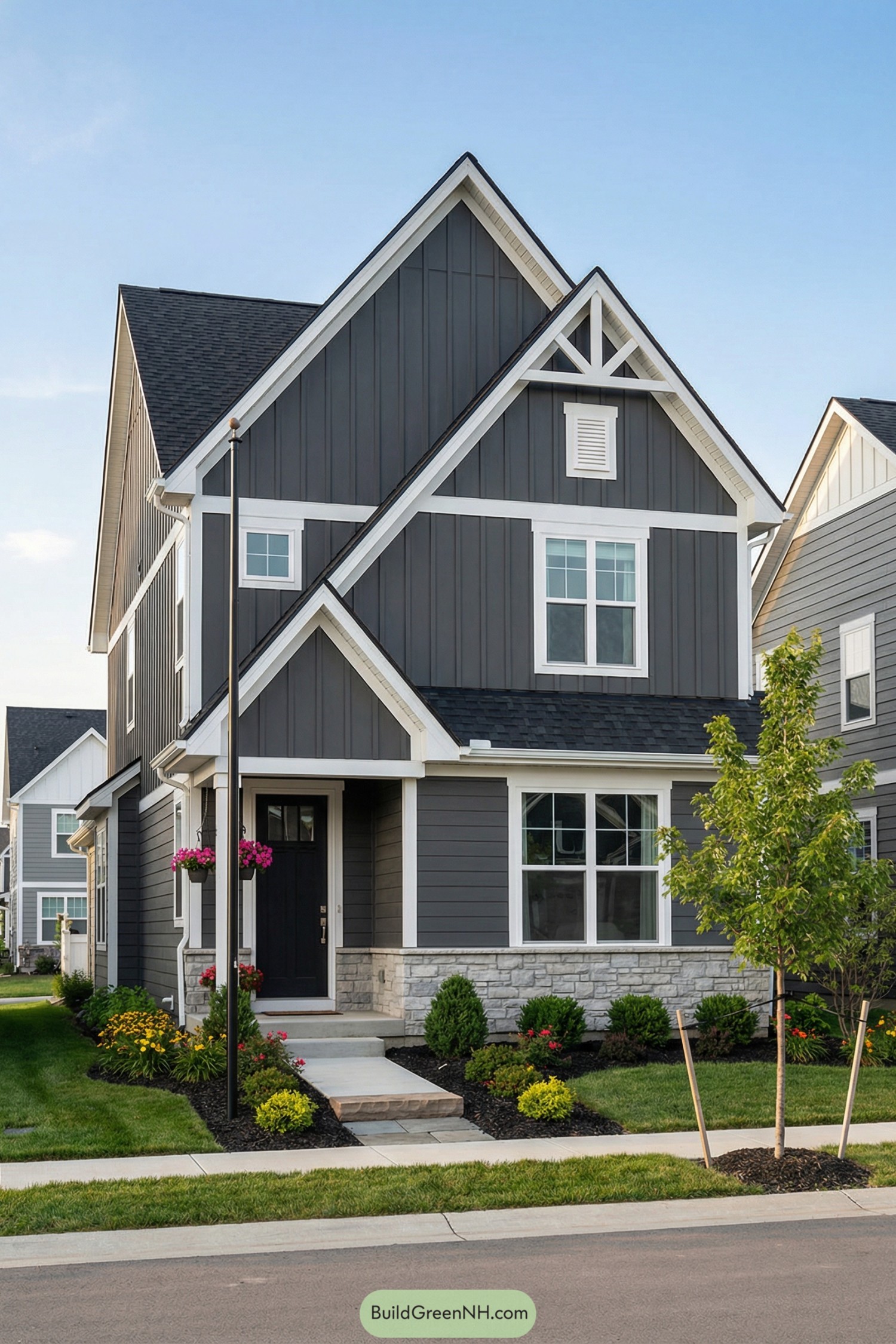 Gray two story house with white trim