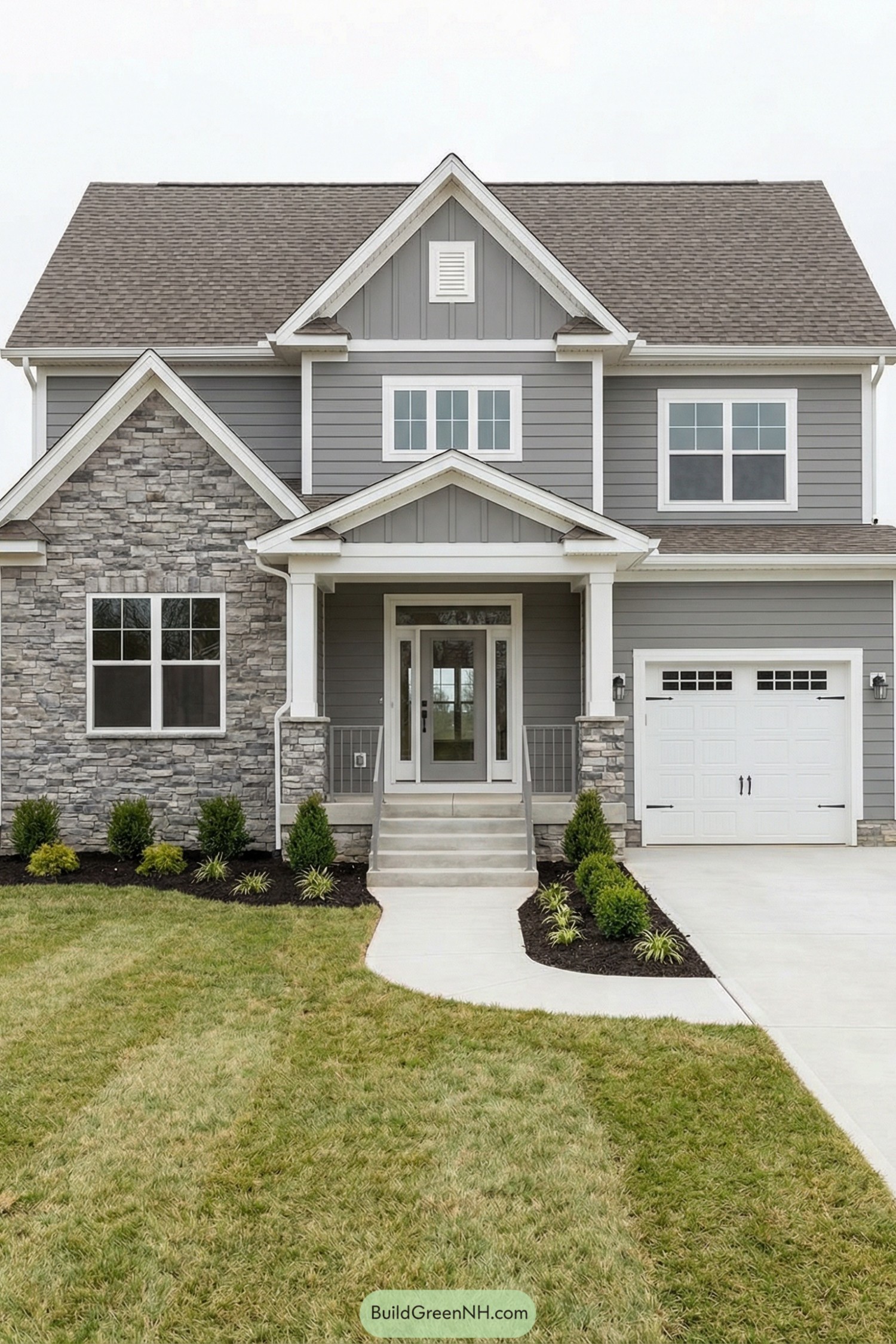 Gray two story house with white trim and stone front