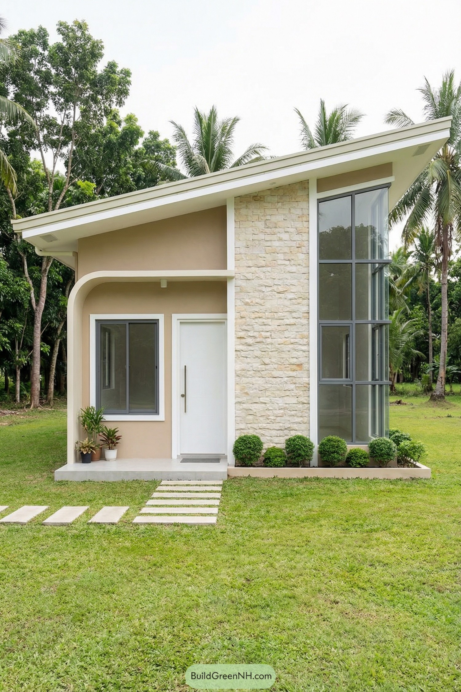Small modern beige cottage with sloped roof and tall corner windows set in a green lawn