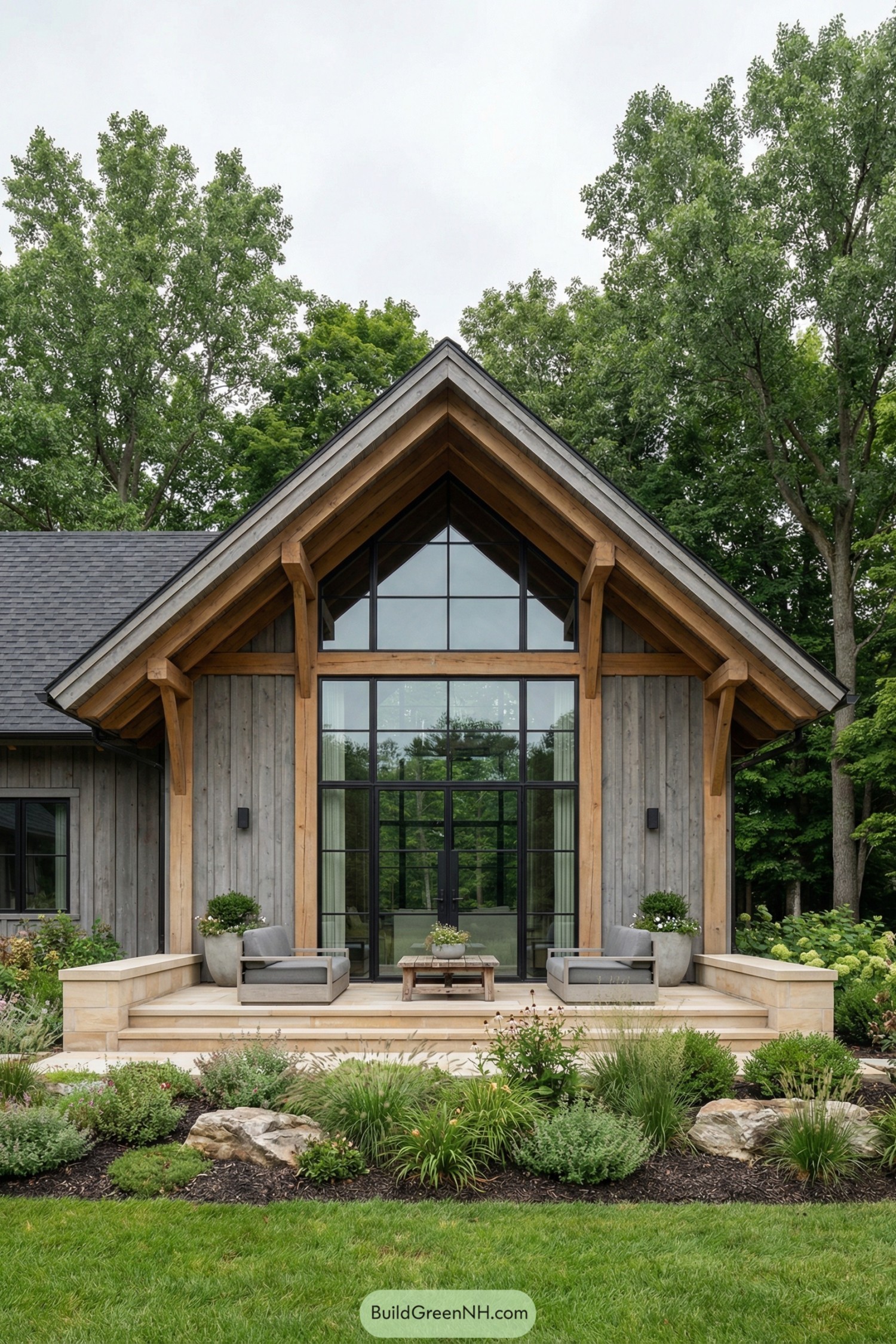 Wood cottage with tall glass façade and landscaped garden