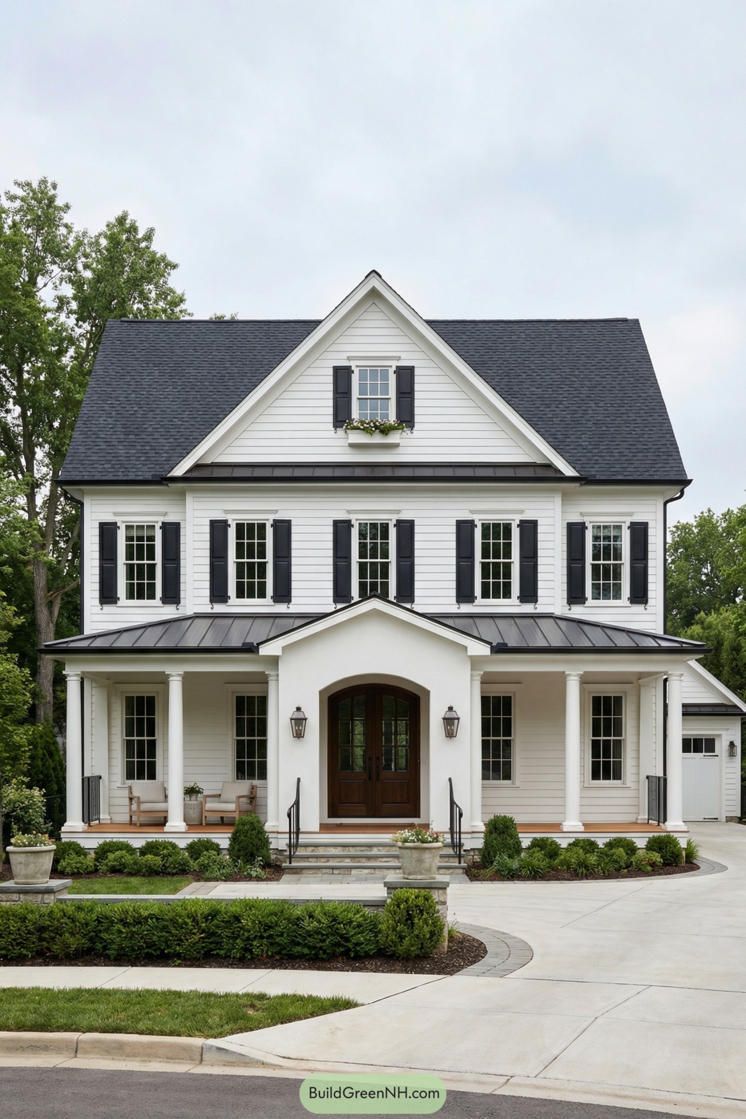 White two story colonial house with black shutters and a welcoming front porch