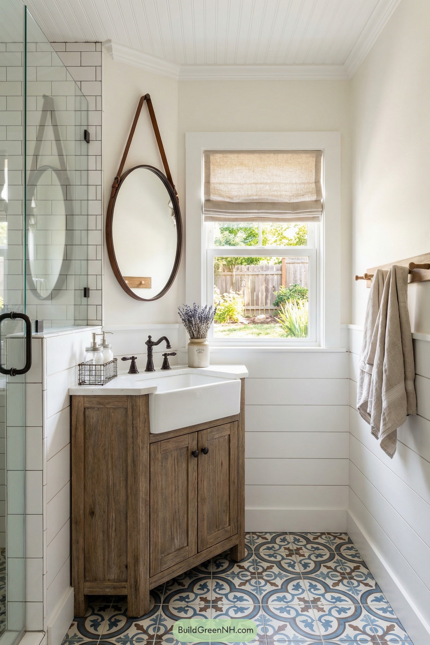 Small cottage bathroom with wood vanity patterned tile and subway tile shower