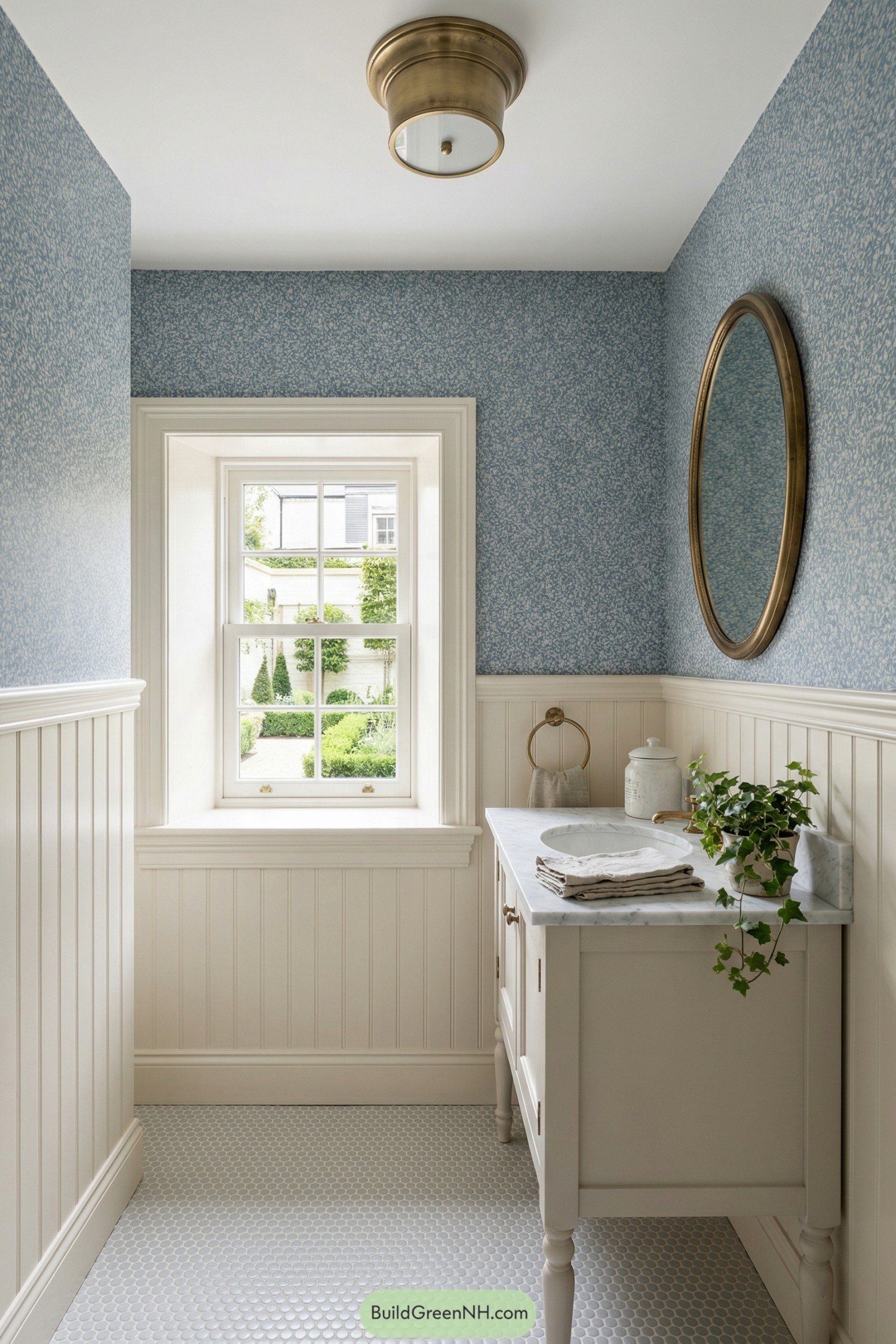 Compact powder room with blue wallpaper, white paneling, window, and small vanity
