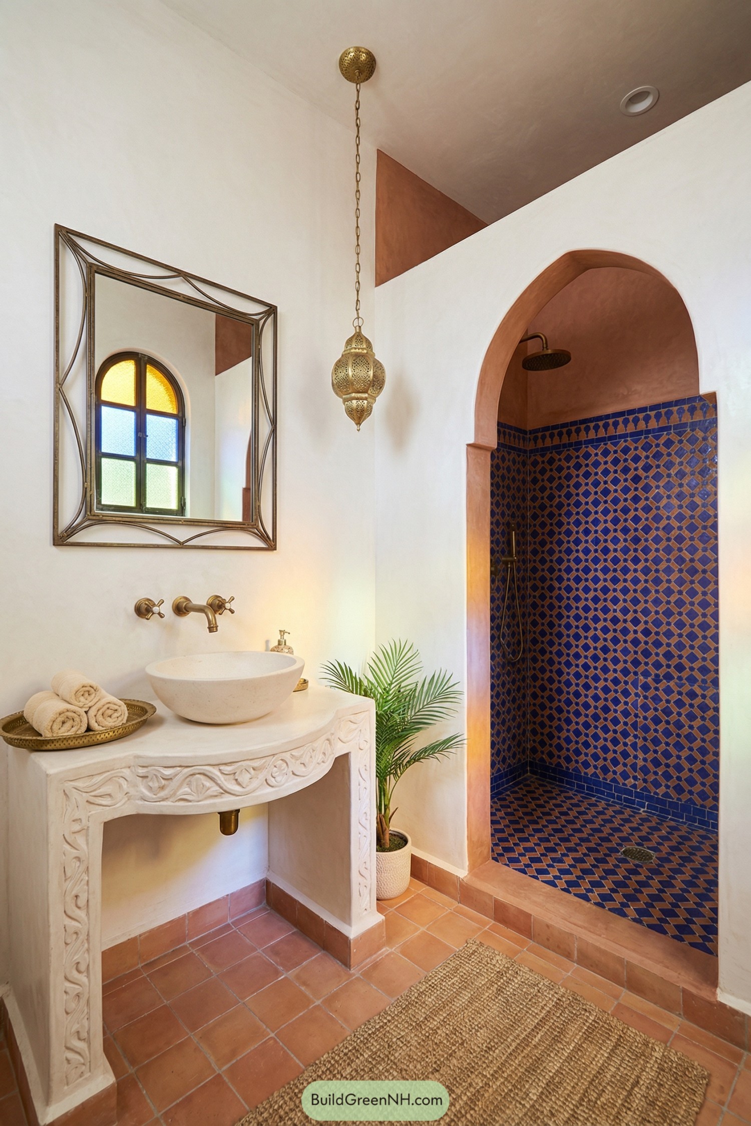 Warm-toned bathroom with arched shower and blue patterned tiles