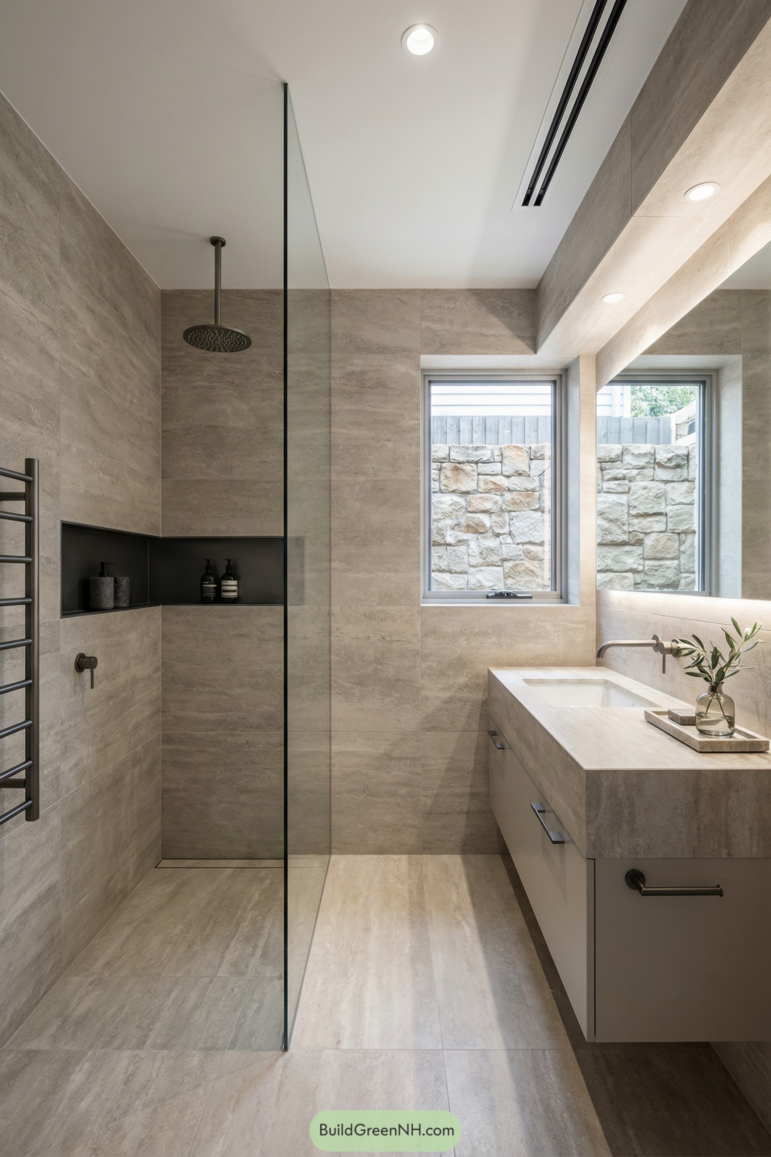 Minimalist limestone bathroom with walk in glass shower and floating vanity
