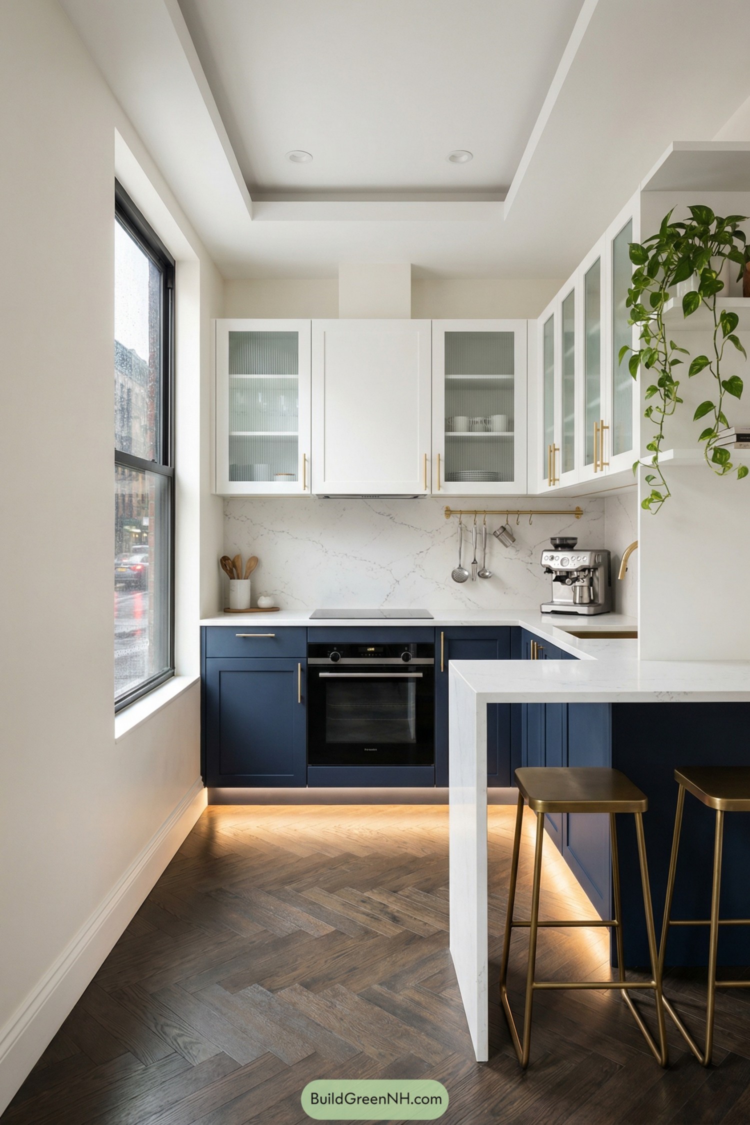 Compact modern kitchen with navy lowers white uppers and brass details