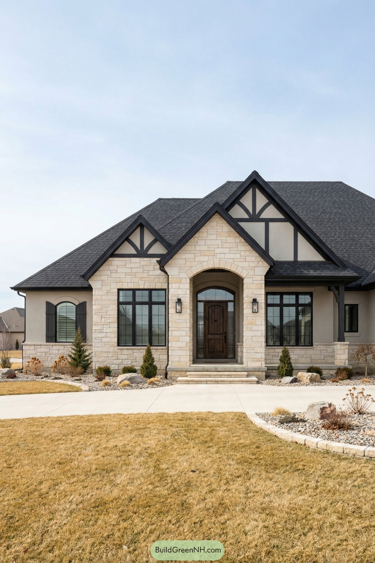 Creamy stone front with dark trim and arched entry
