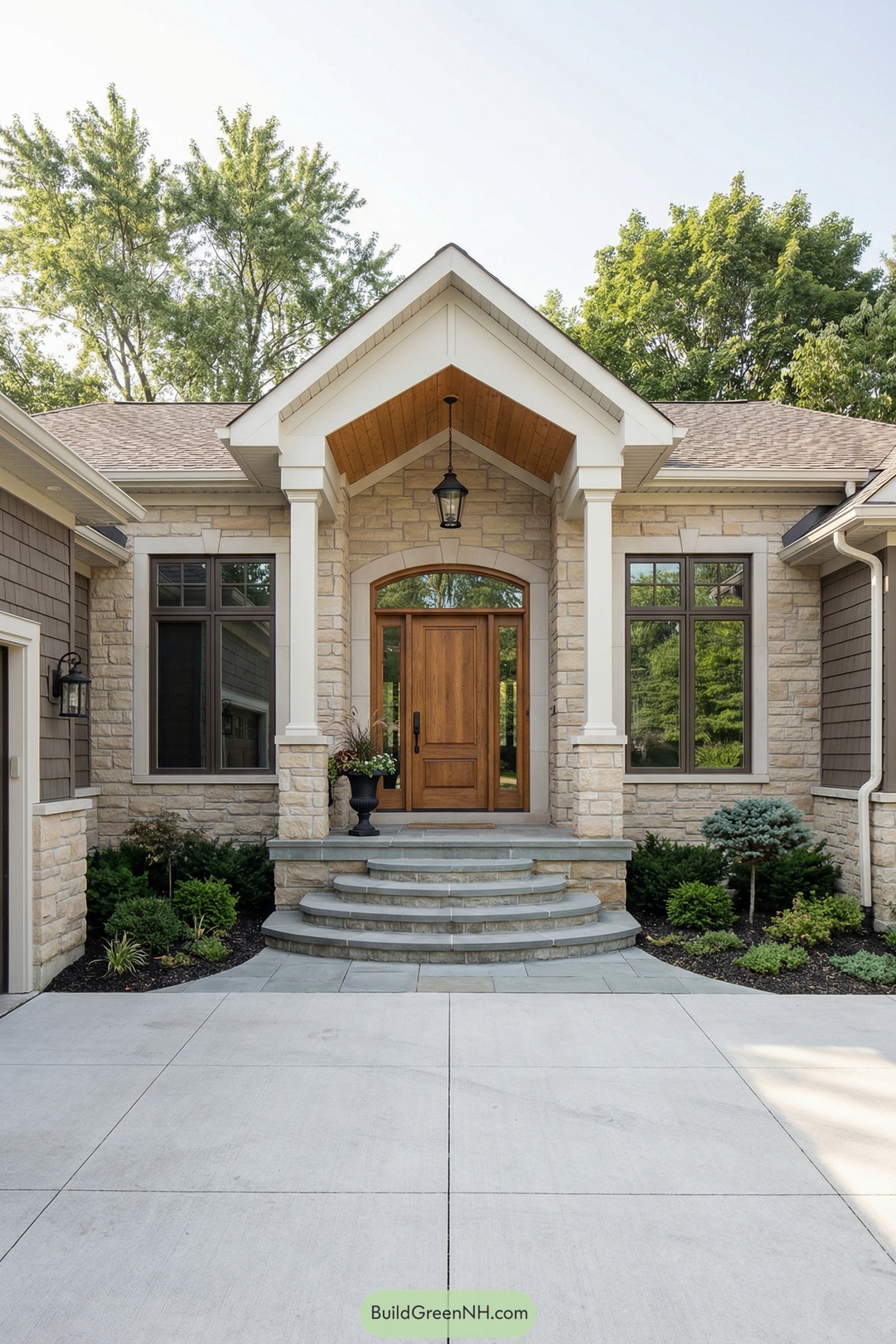 Stone front entry with curved steps gabled porch and wooden door