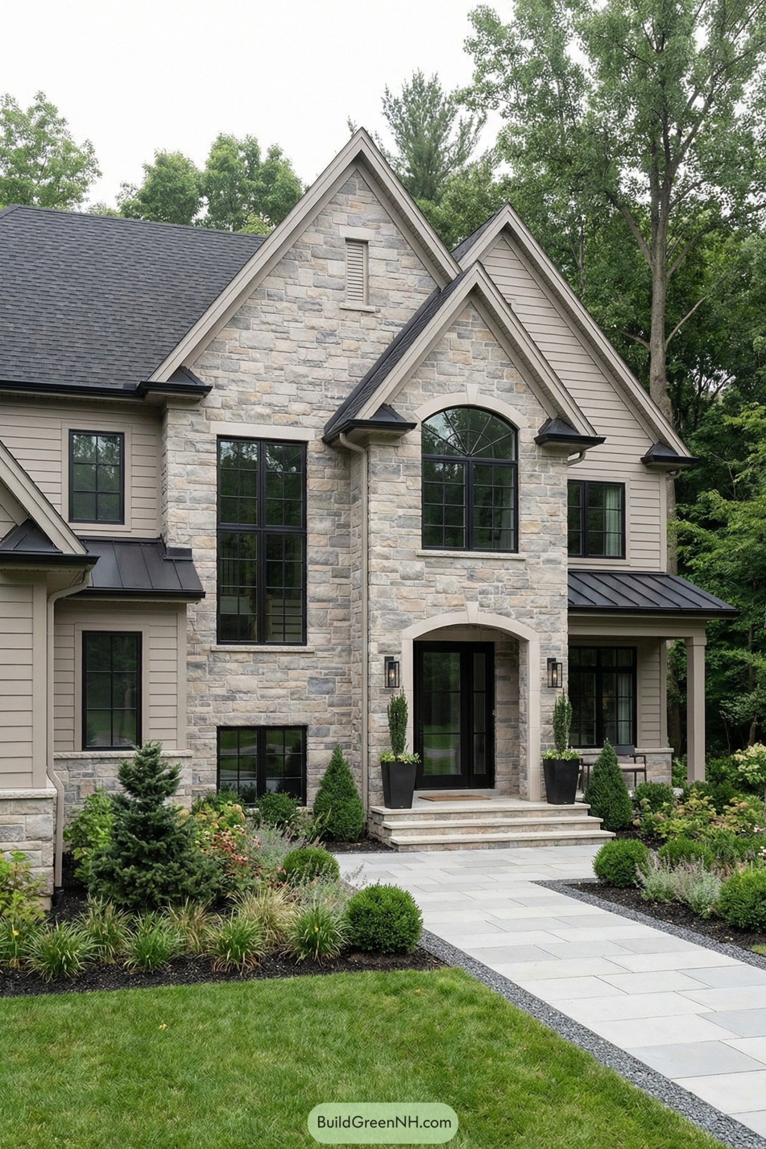 Modern stone front entry with tall windows